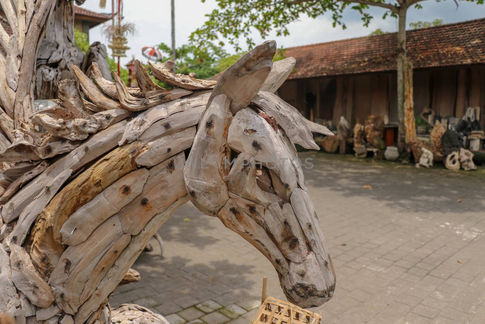 Pegasus horse statue. Art and work of Balinese artists. Wooden art. A winged horse made of wooden pieces. Big horse head art statue from wooden pieces. Ubud, Bali, Indonesia.
