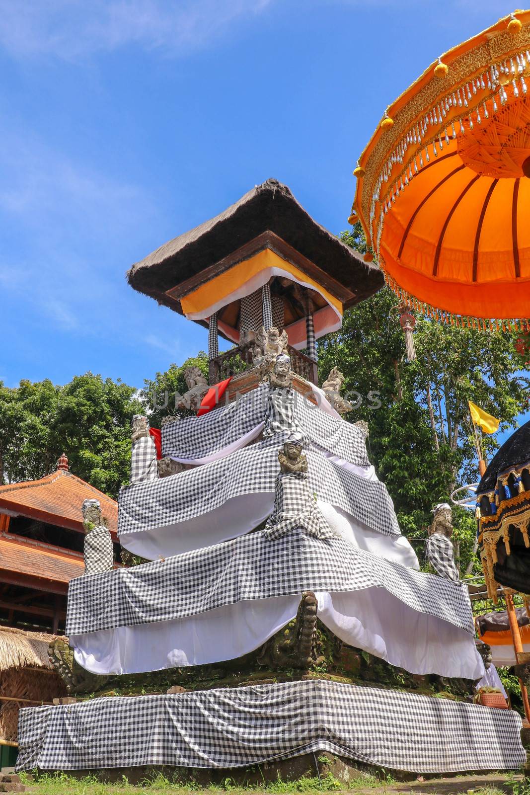 Balinese drum pavilion bale kulkul - bale kul-kul, for a slit-log drum, Bali, Indonesia. Bale kulkul at temple Pura Batukaru. Hindu religion, architecture and art. Vertical image.