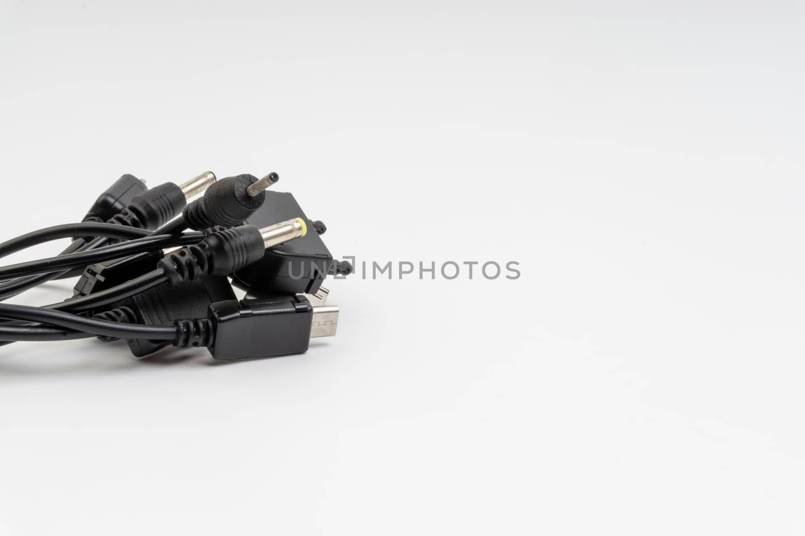 Universal recharger head or usb cable isolated on white background by silverwings