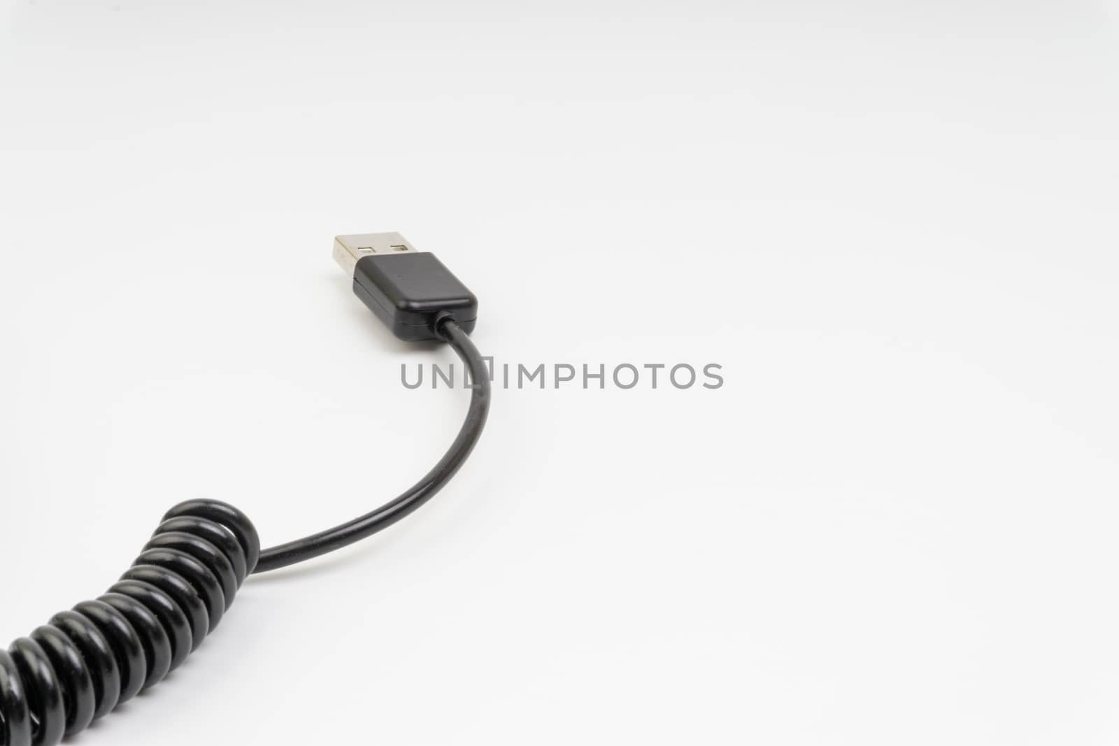 Universal recharger head or usb cable isolated on white background. Selective focus and crop fragment