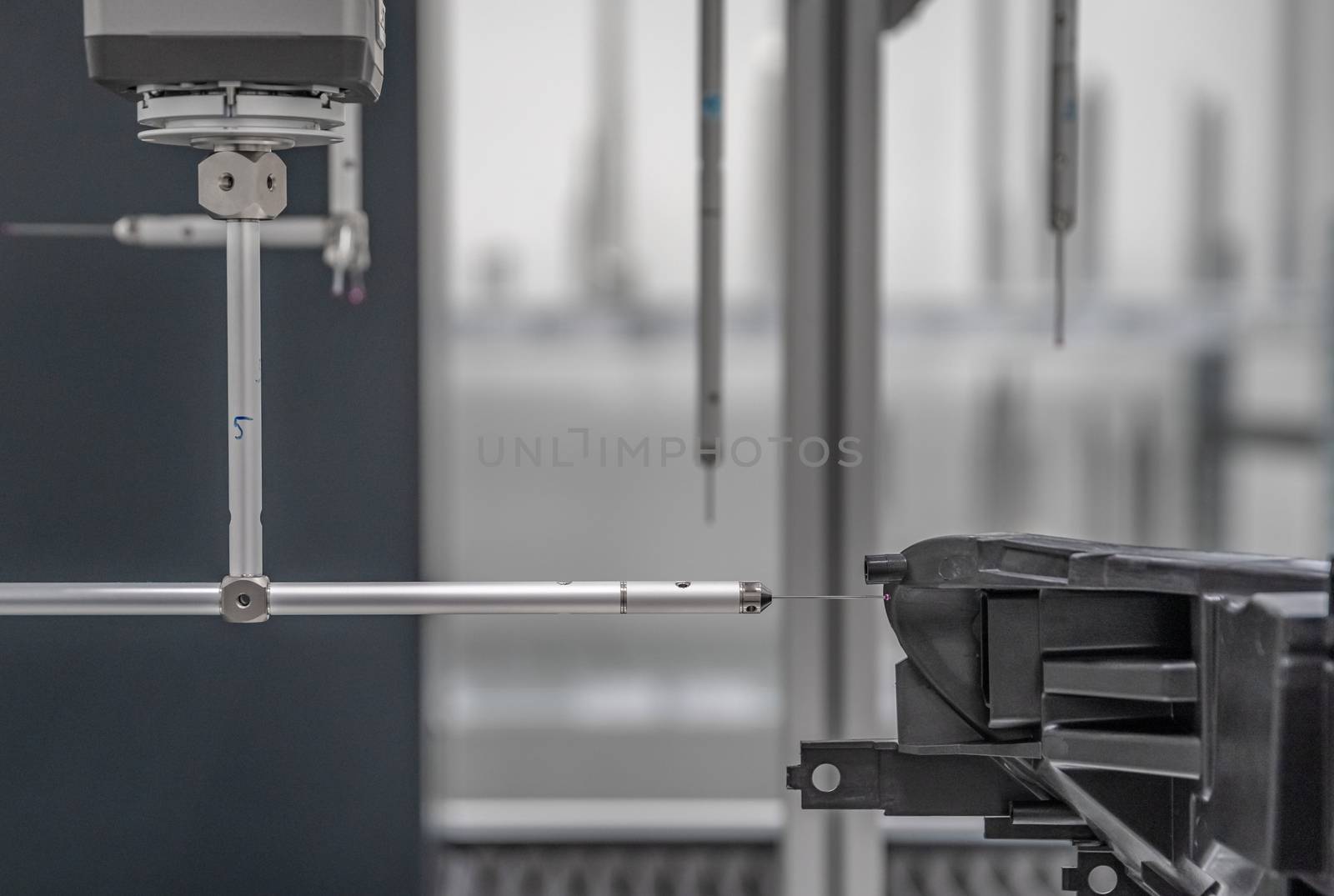 3D measuring device in a factory for the production of plastic castings for the automotive industry by Edophoto