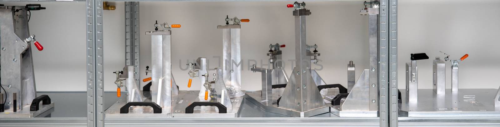rack with tools for precise 3D measurement of plastic products for the automotive industry.