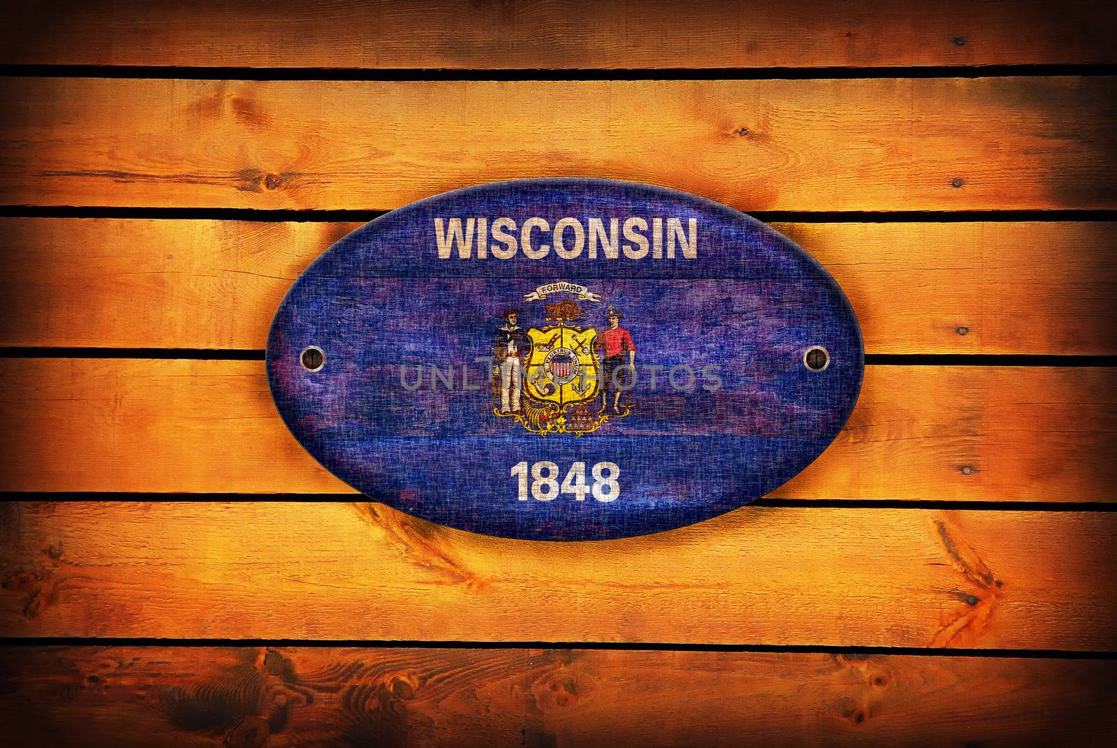 Wisconsin flag on brown wooden planks.