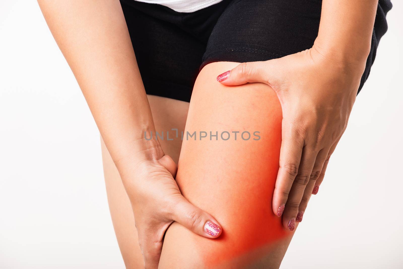 Closeup young Asian woman have cramp calf tired pain legs she holding her leg painful, studio shot isolated on white background, Healthcare medical and hygiene skin body problems care concept