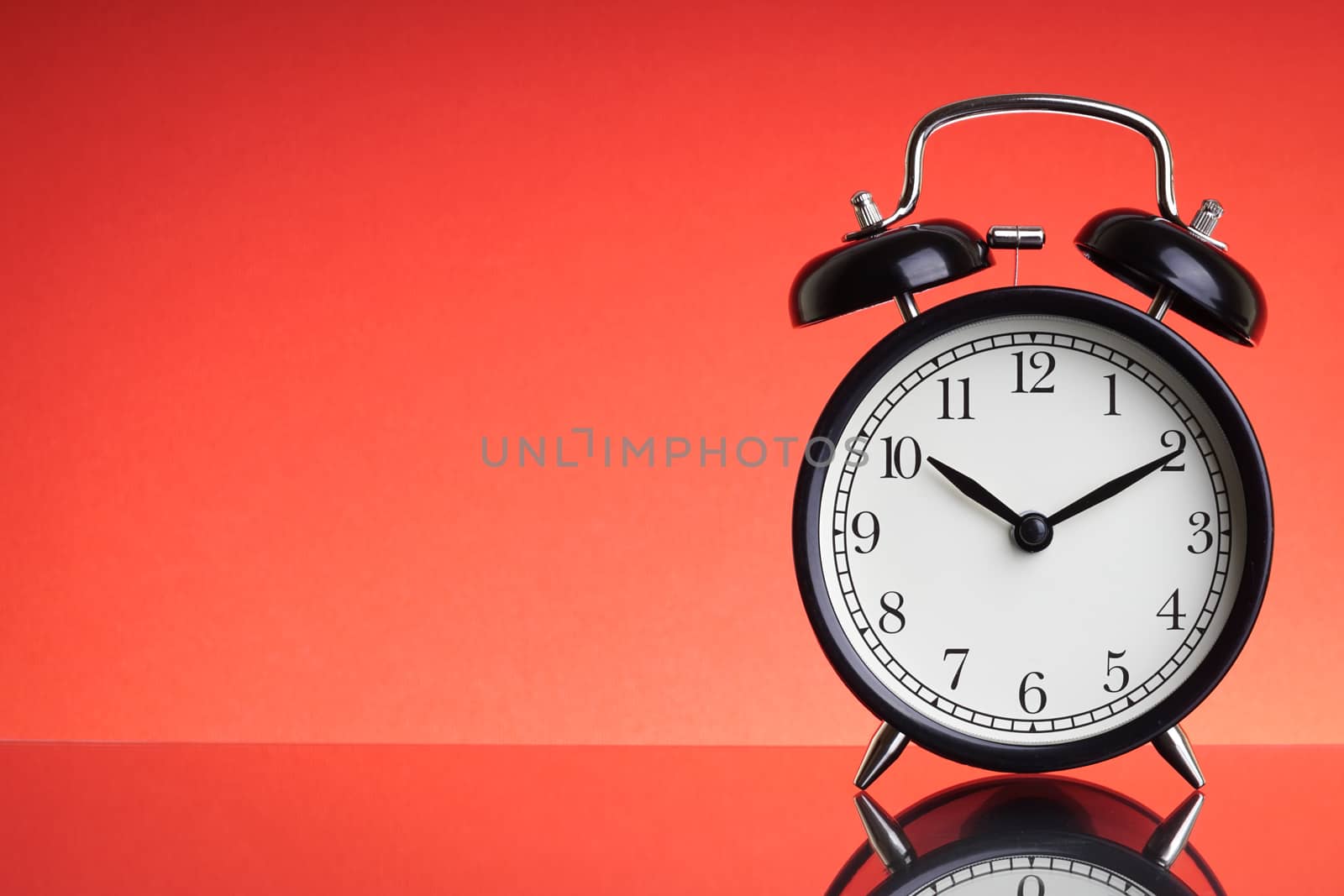 Alarm Clock on red background with selective focus by silverwings