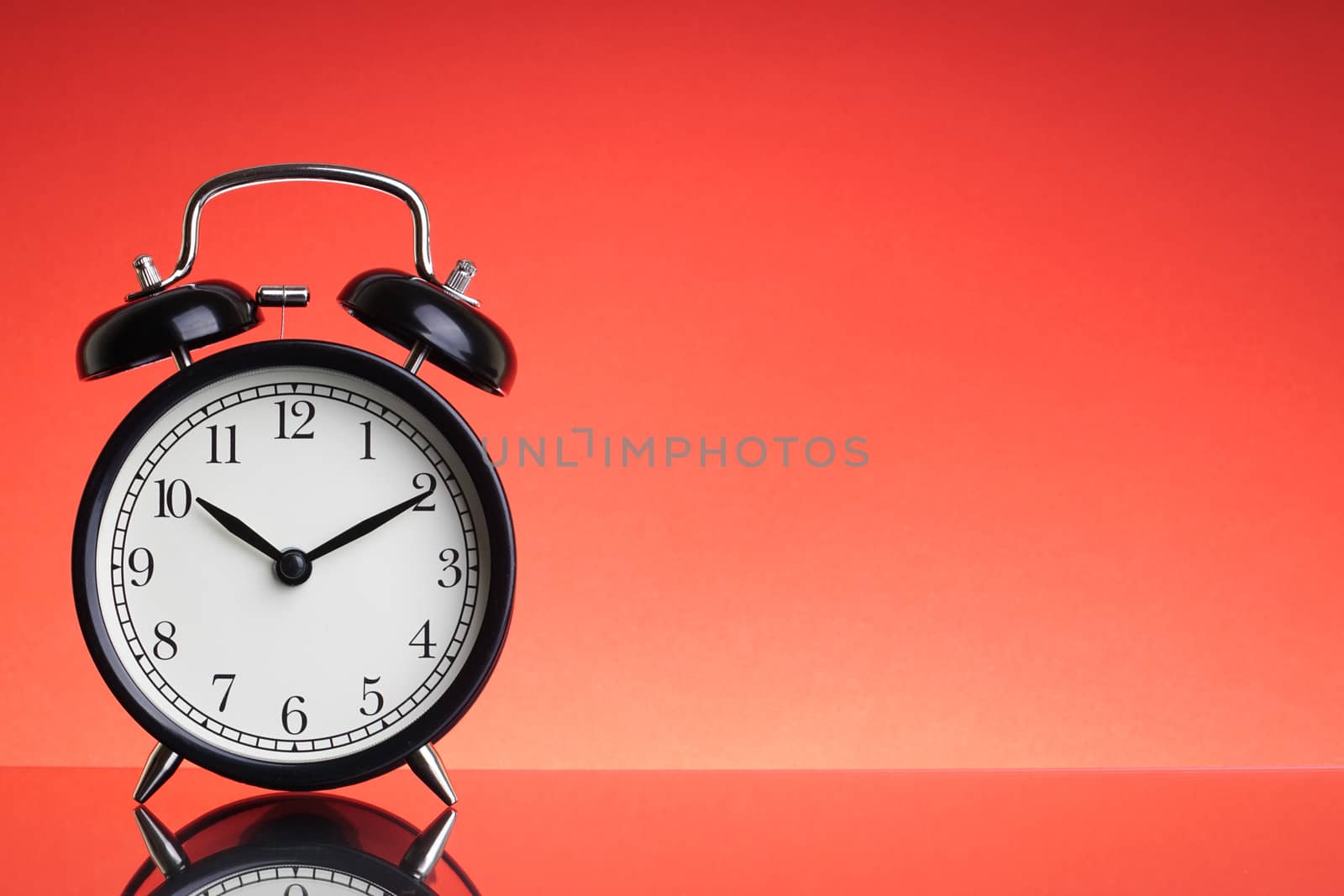 Alarm Clock on red background with selective focus by silverwings