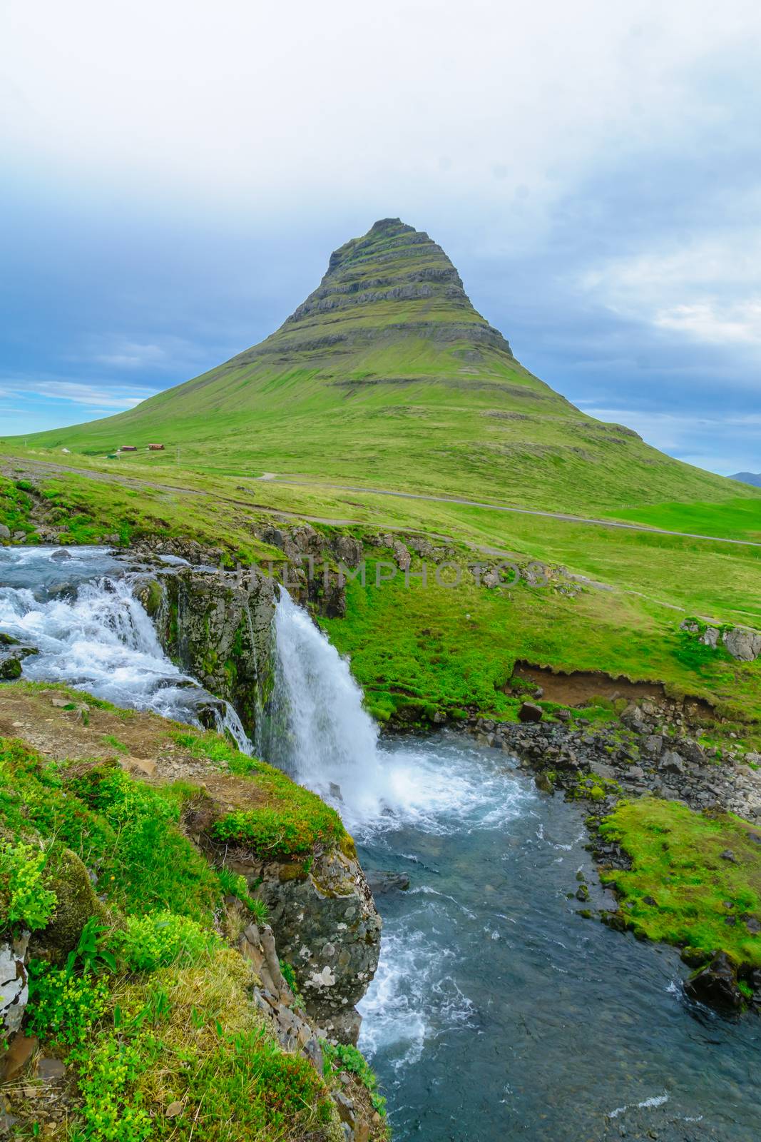View of the Kirkjufell mountain (Church mountain), and the Kirkjufellsfoss waterfalls, in the Snaefellsnes peninsula, west Iceland