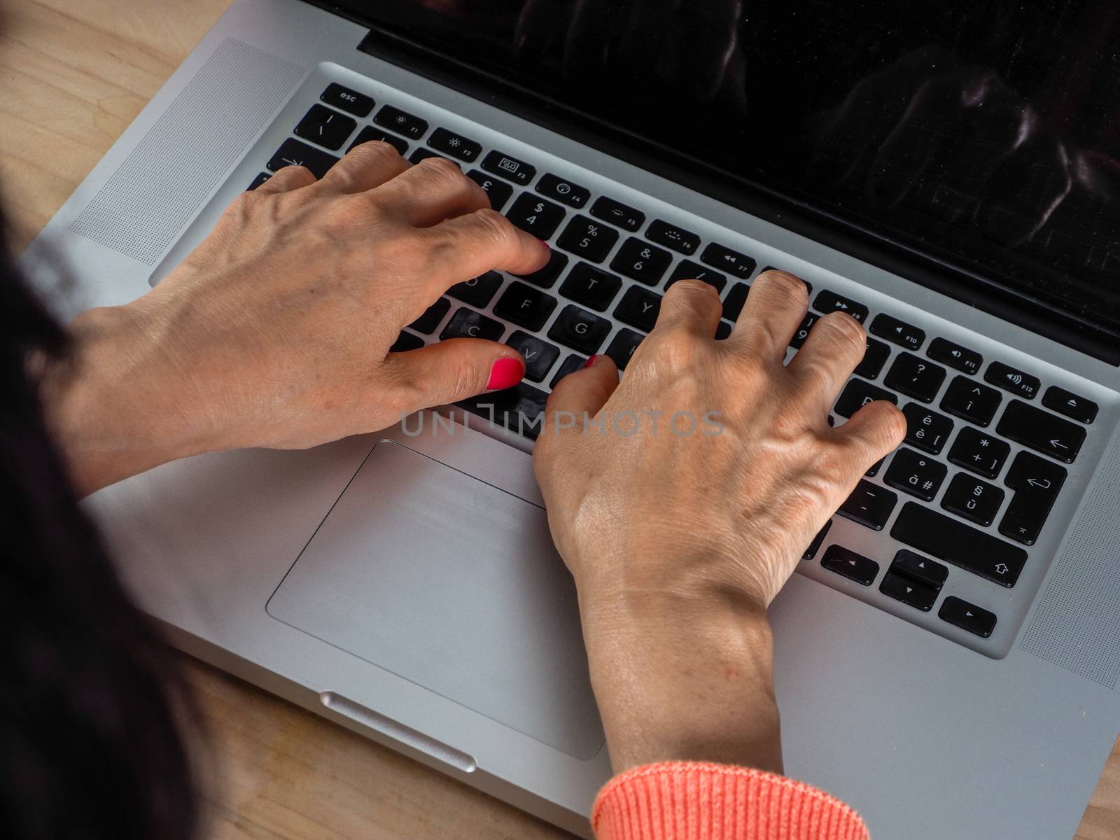 Woman hand s freelance working on a notebook laptop computer at by verbano