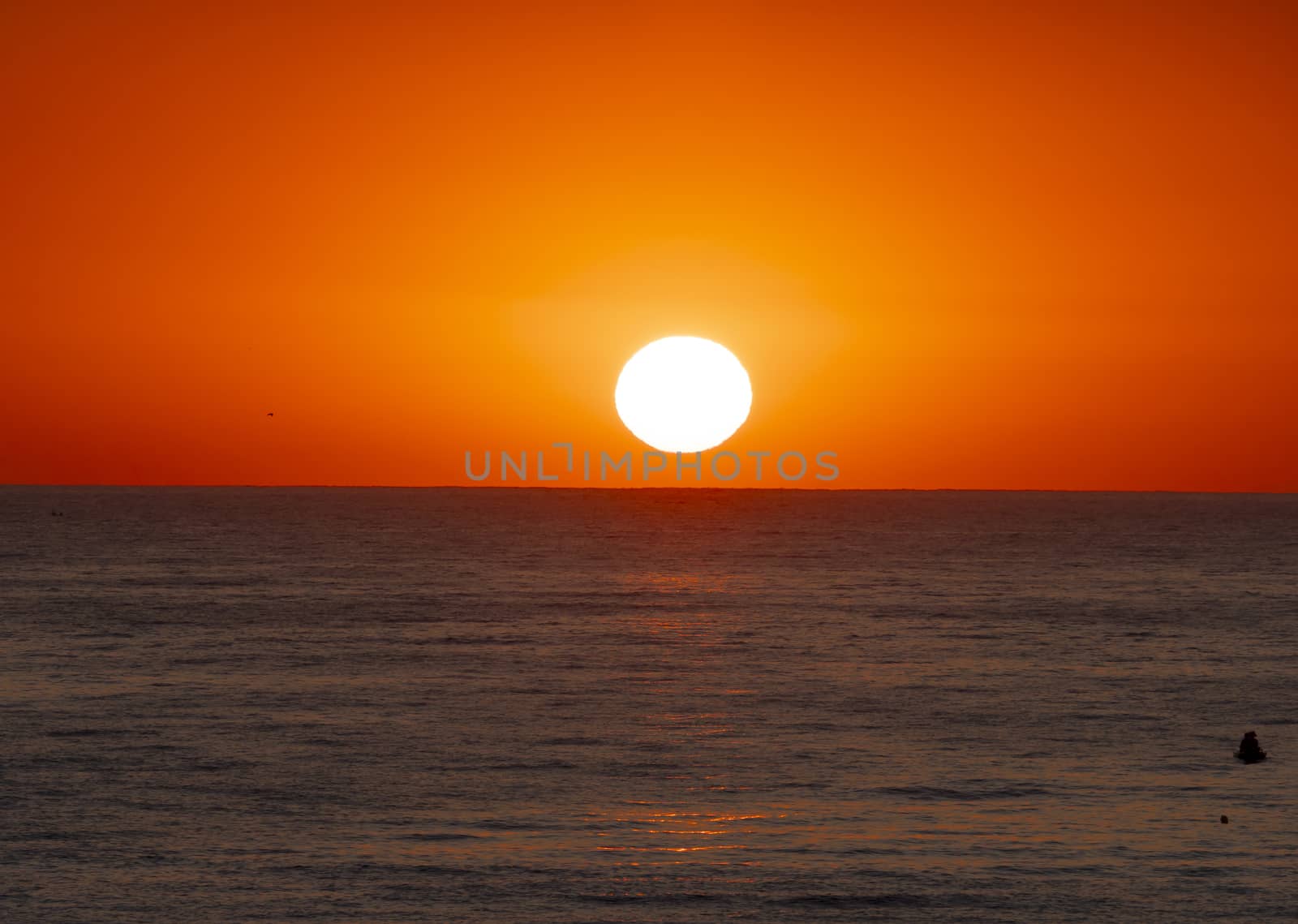 big sun down over sea, red sky
