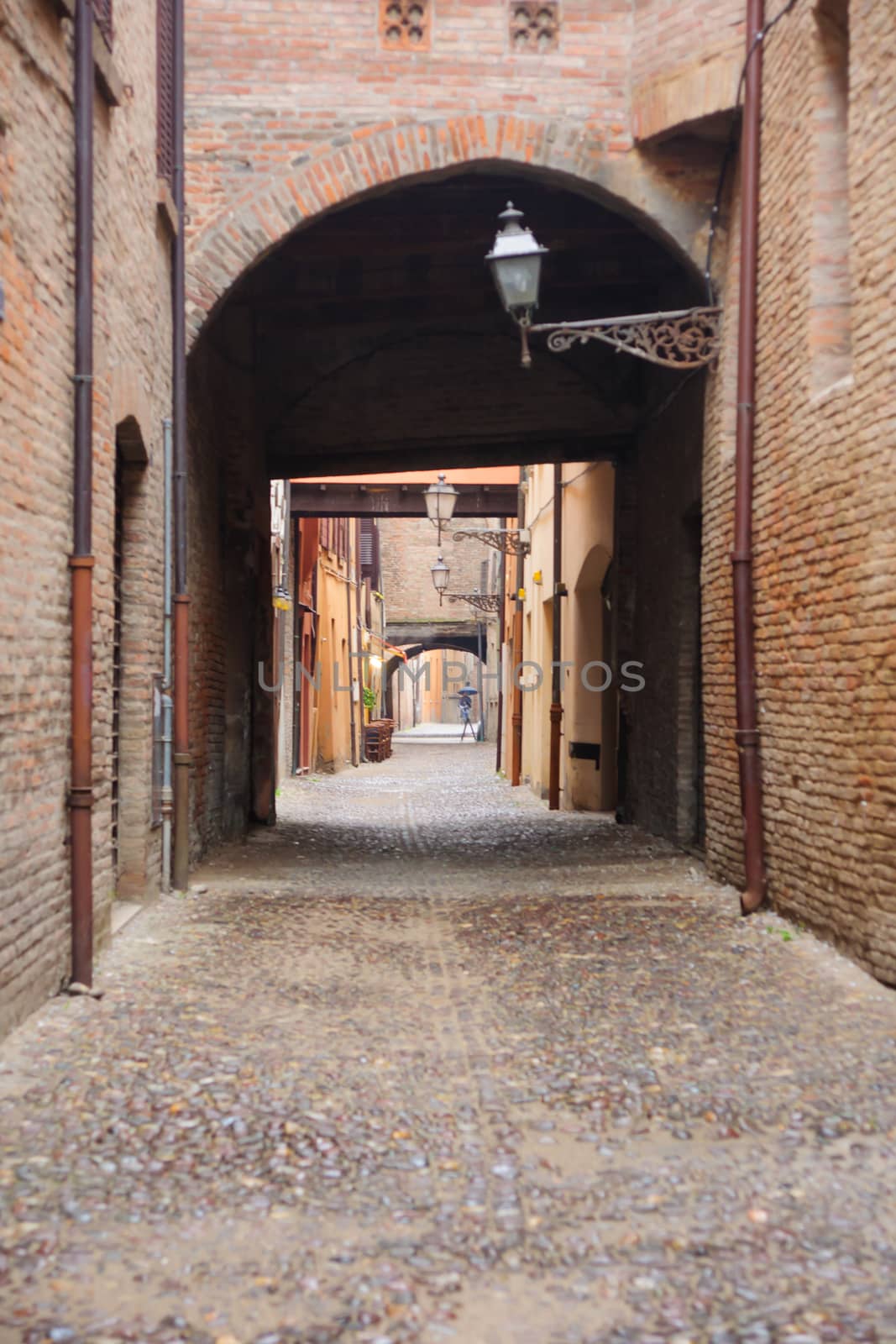 An alley in the old city of Ferrara, Emilia-Romagna, Italy