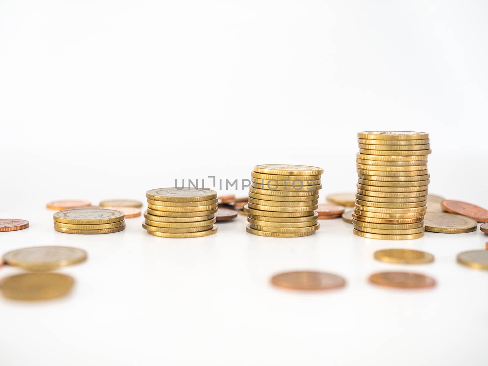 Thai Baht Coins colors Gold set in the mountains,Is the currency of Thailand.For business expenses,Coin is in a jar of money saving,White background