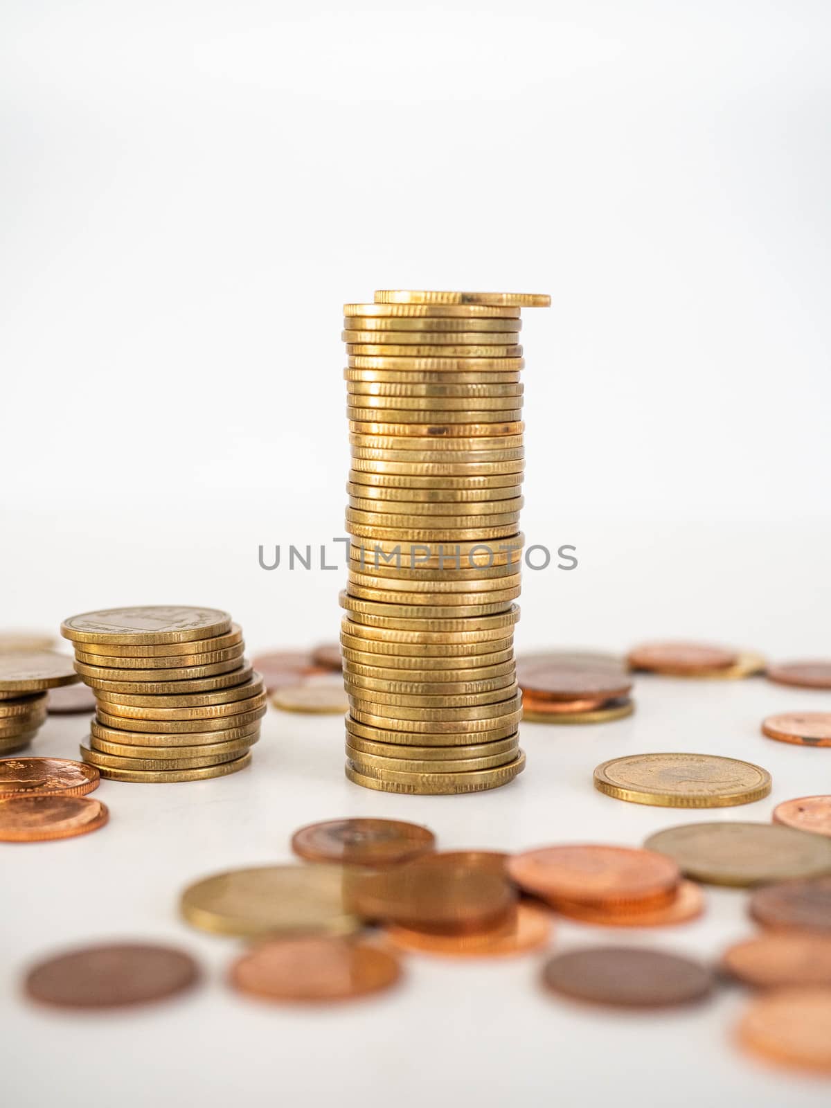 Thai Baht Coins colors Gold set in the mountains,Is the currency of Thailand.For business expenses,Coin is in a jar of money saving,White background