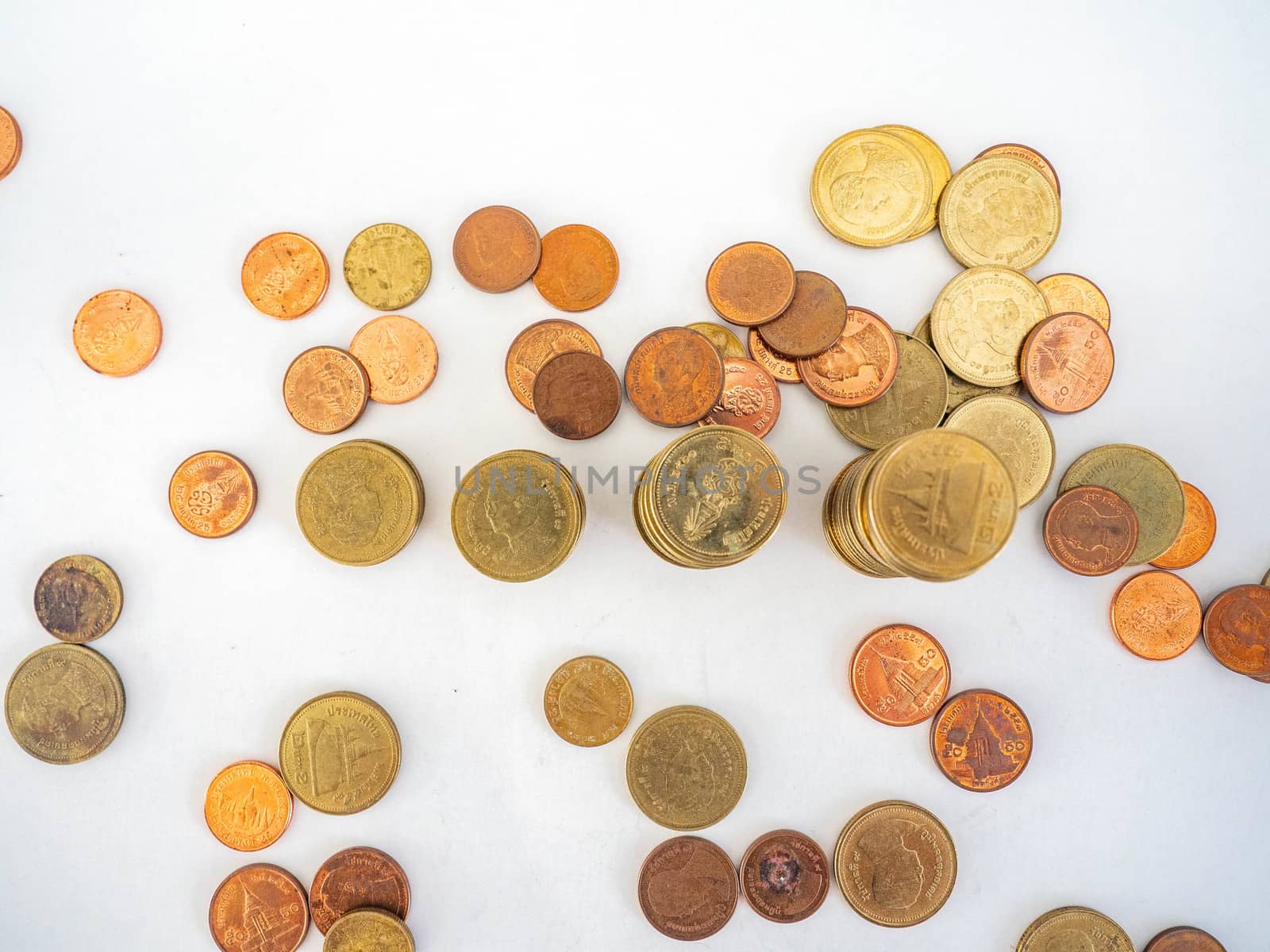 Thai Baht Coins colors Gold set in the mountains,Is the currency of Thailand.For business expenses,Coin is in a jar of money saving,White background