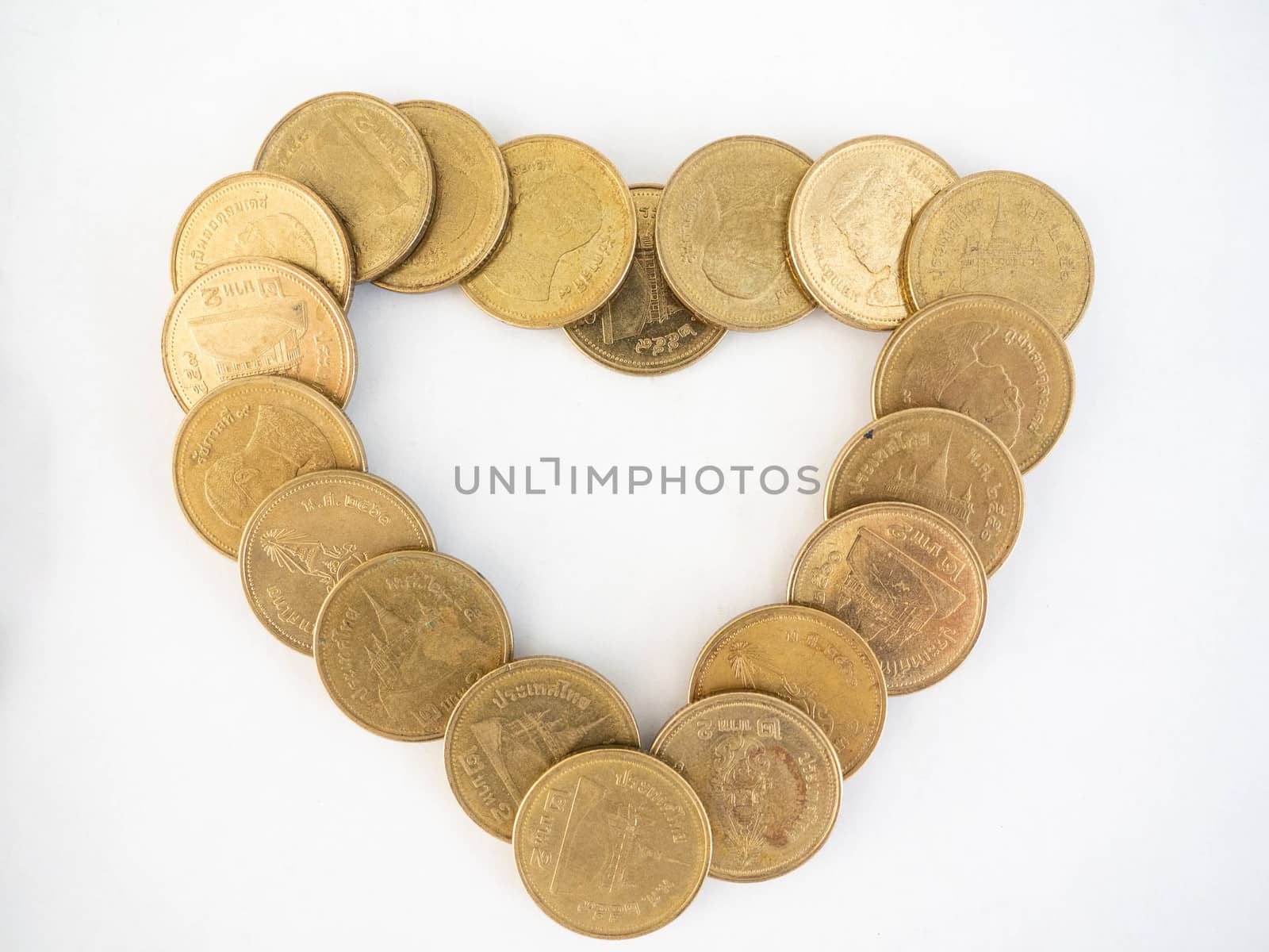 Thai Baht Coins colors Gold set in the Shape dollar,Is the currency of Thailand.For business expenses,Coin is in a jar of money saving,White background