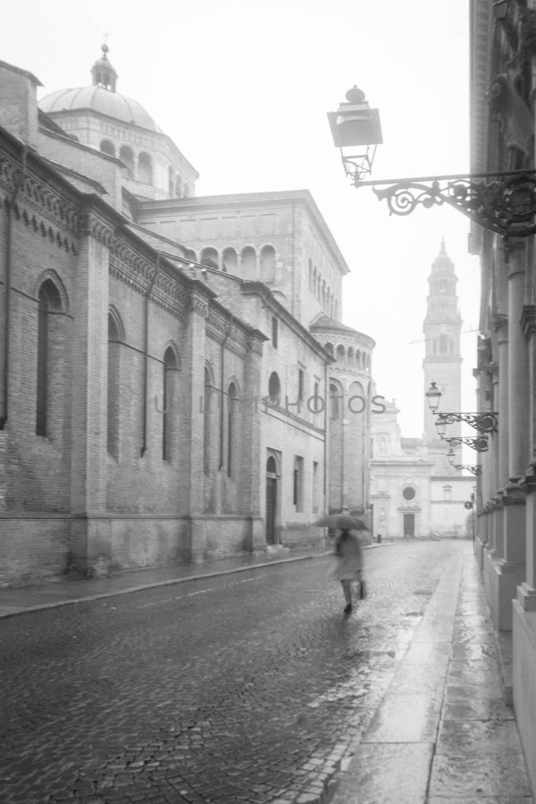 Street scene and the San Giovanni Evangelista church in Parma, Emilia-Romagna, Italy
