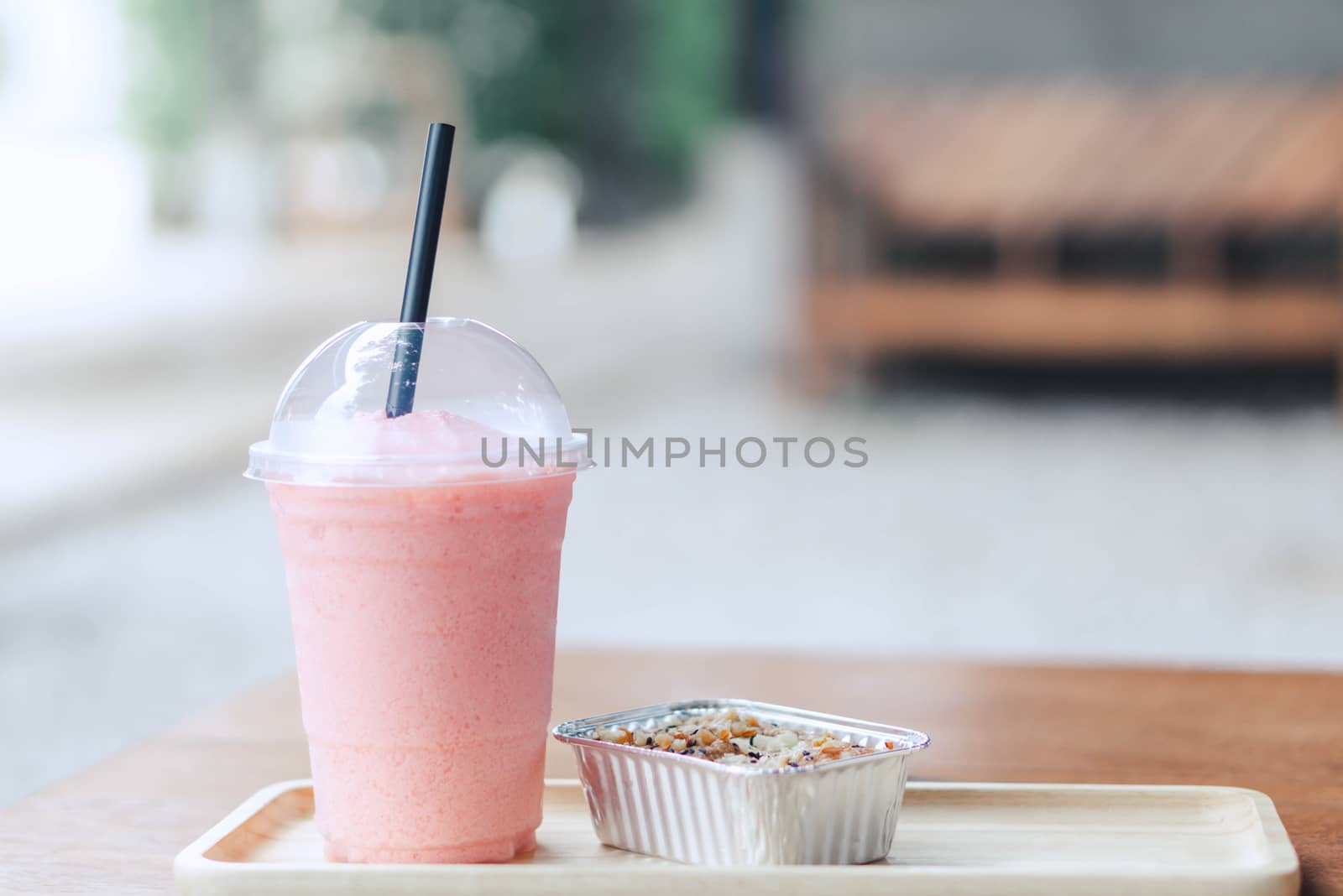 Closeup  strawberry smoothie and cake with green nature backgrou by pt.pongsak@gmail.com