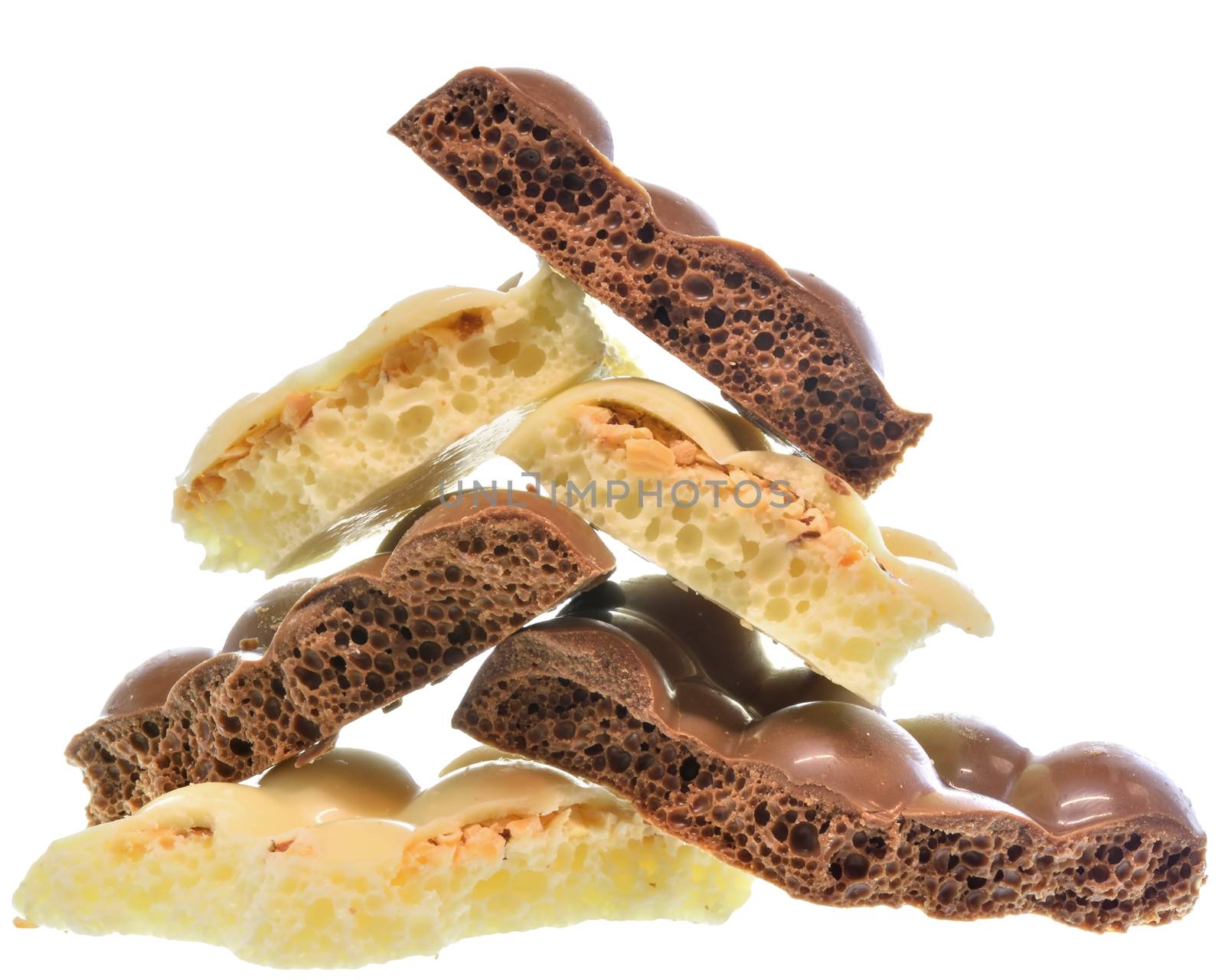 Broken heap porous chocolate Isolated on a white background.