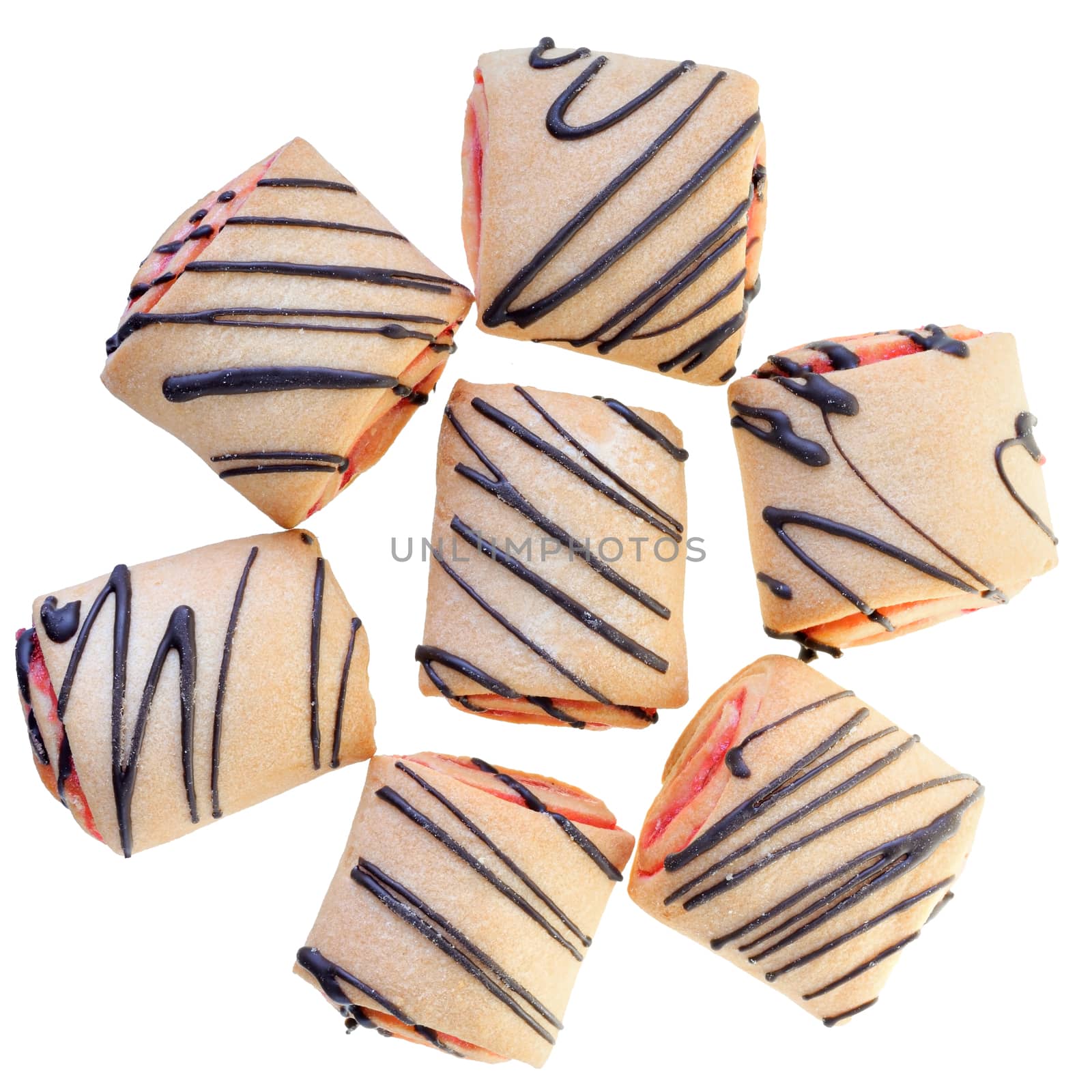 Cookies rolls with strawberry jam and chocolate icing top view isolated on a white background.