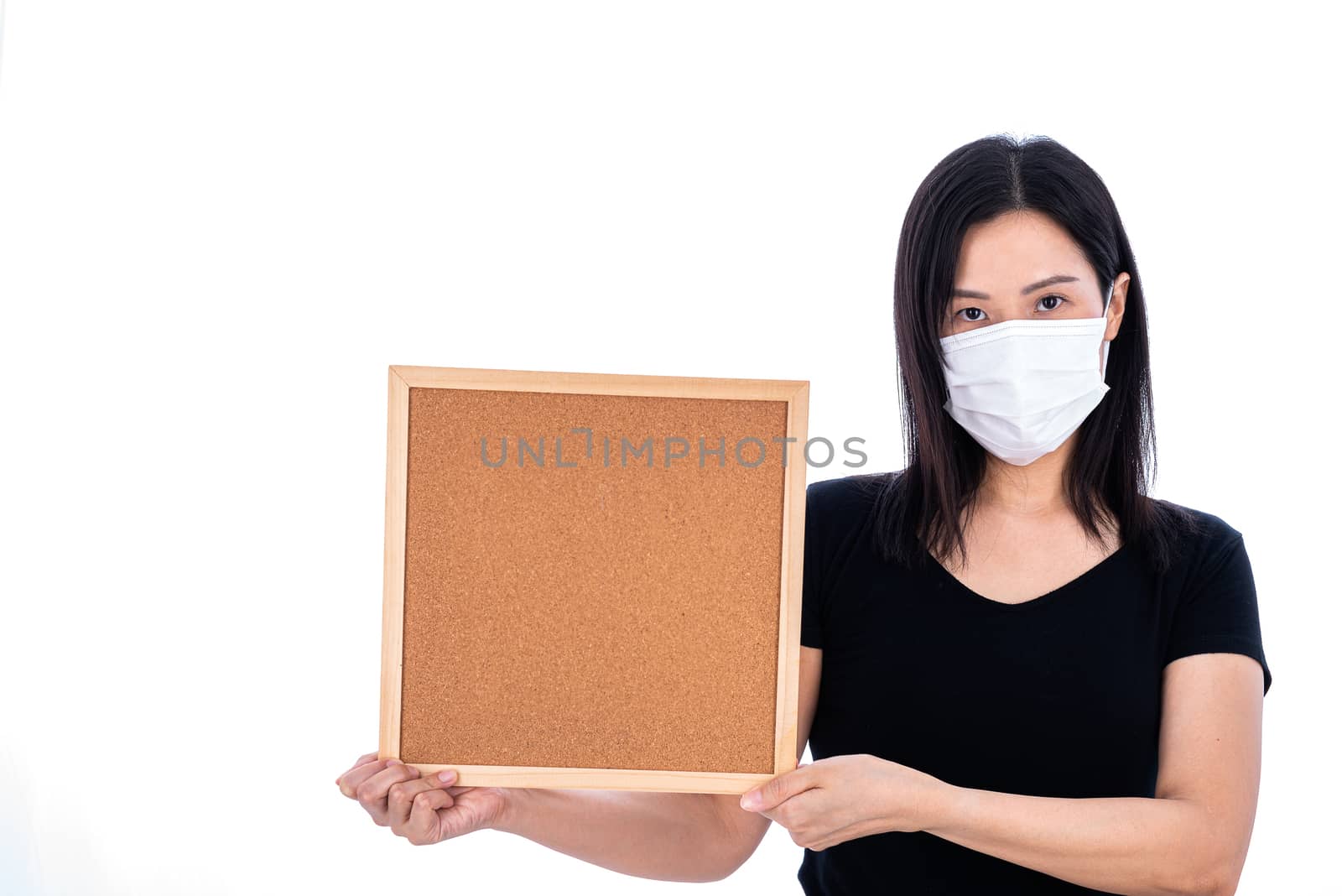 An Asian woman holding an empty board for writing COVID-19 prevention isolated on white background.