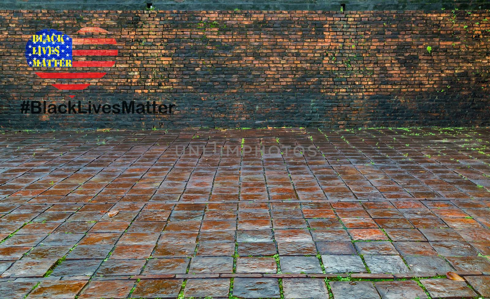 Black Lives Matter slogan hashtag liberation banner protestors heart stencil on American flag USA city street brick dirty old wall.
