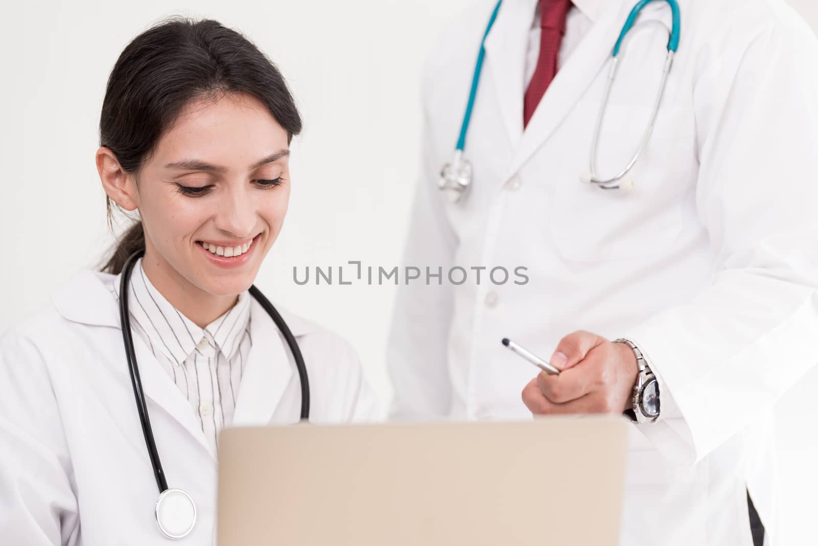 Two doctors have working together with happiness in the hospital.