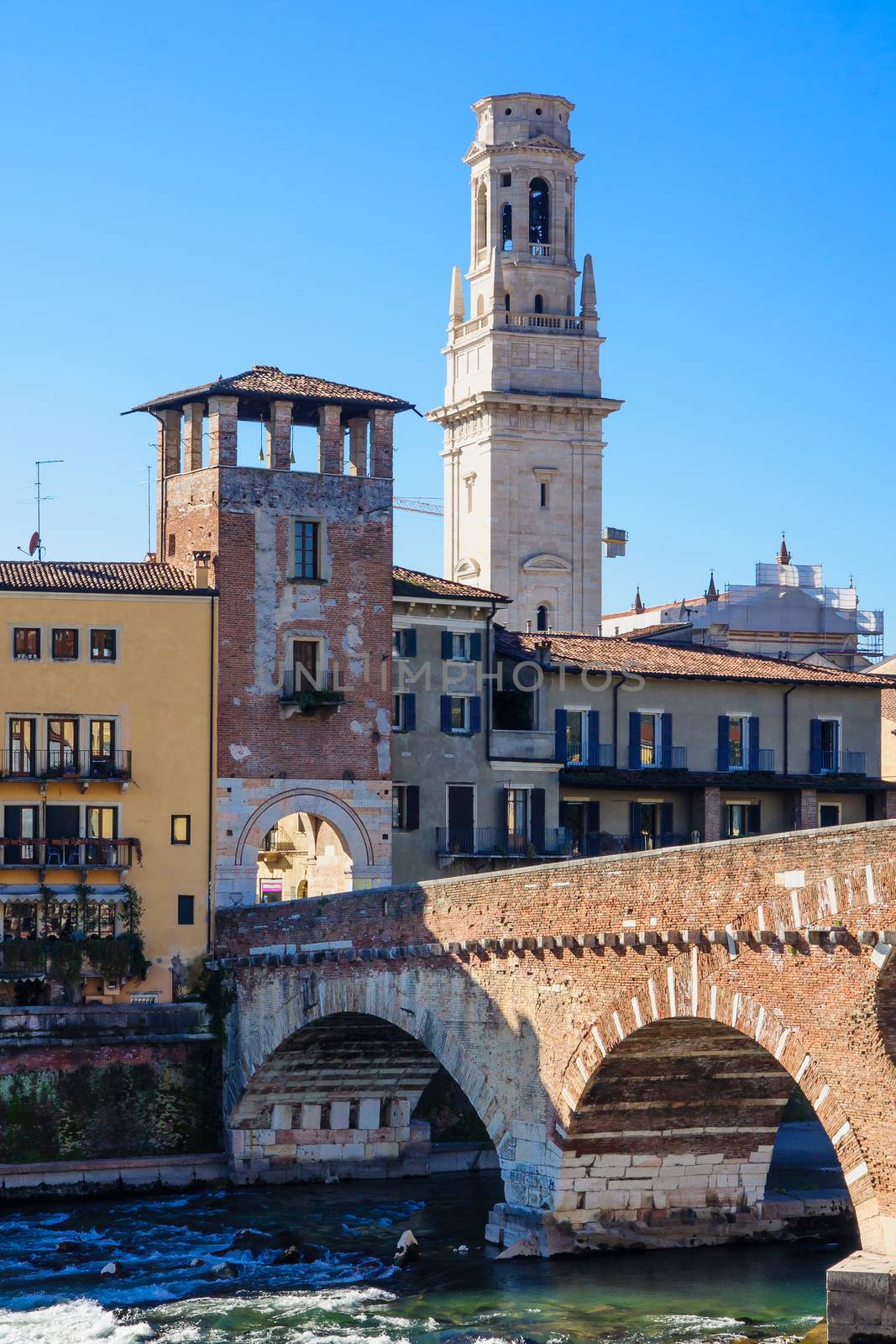 The Ponte Pietra Bridge and the Duomo tower, in Verona, Veneto, Italy