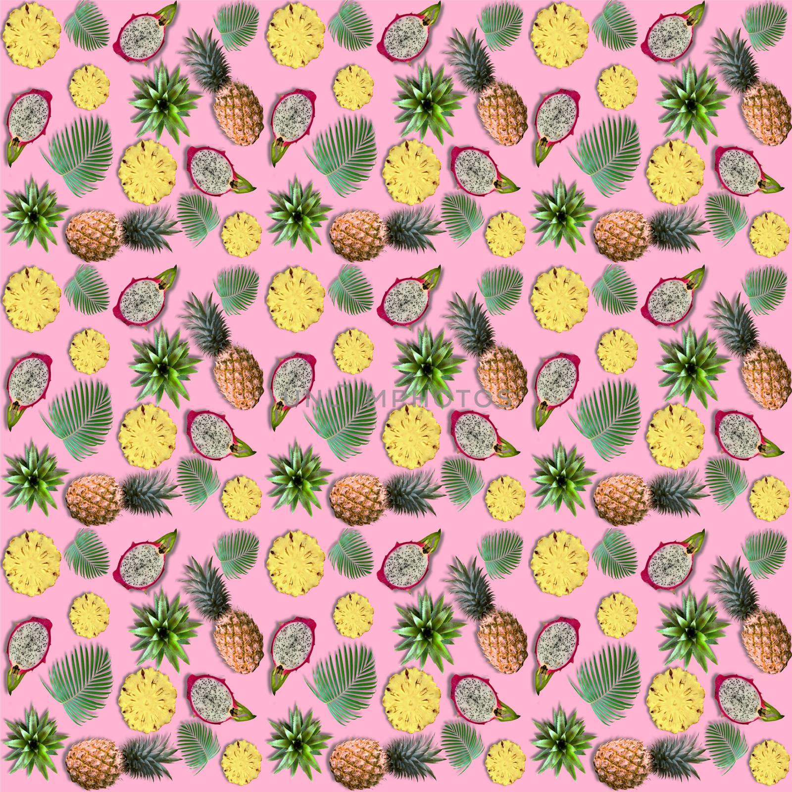 Exotic fruits and tropical palm leaves on pink background. by Margolana