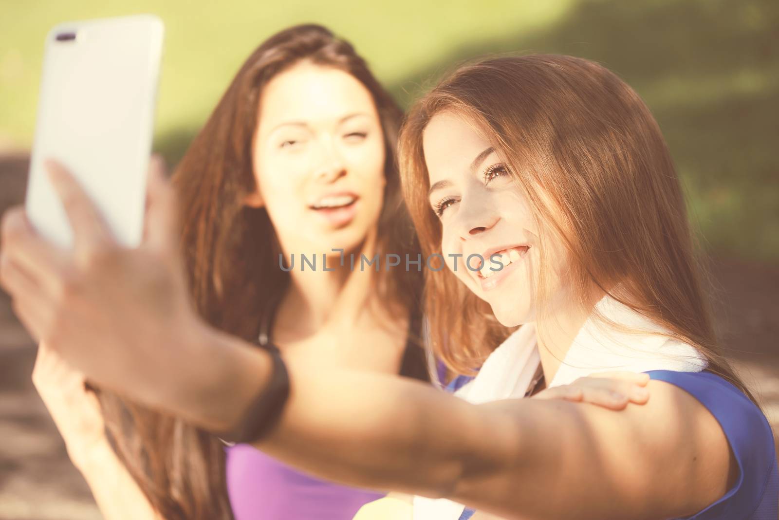 Girls taking selfie by wdnet_studio