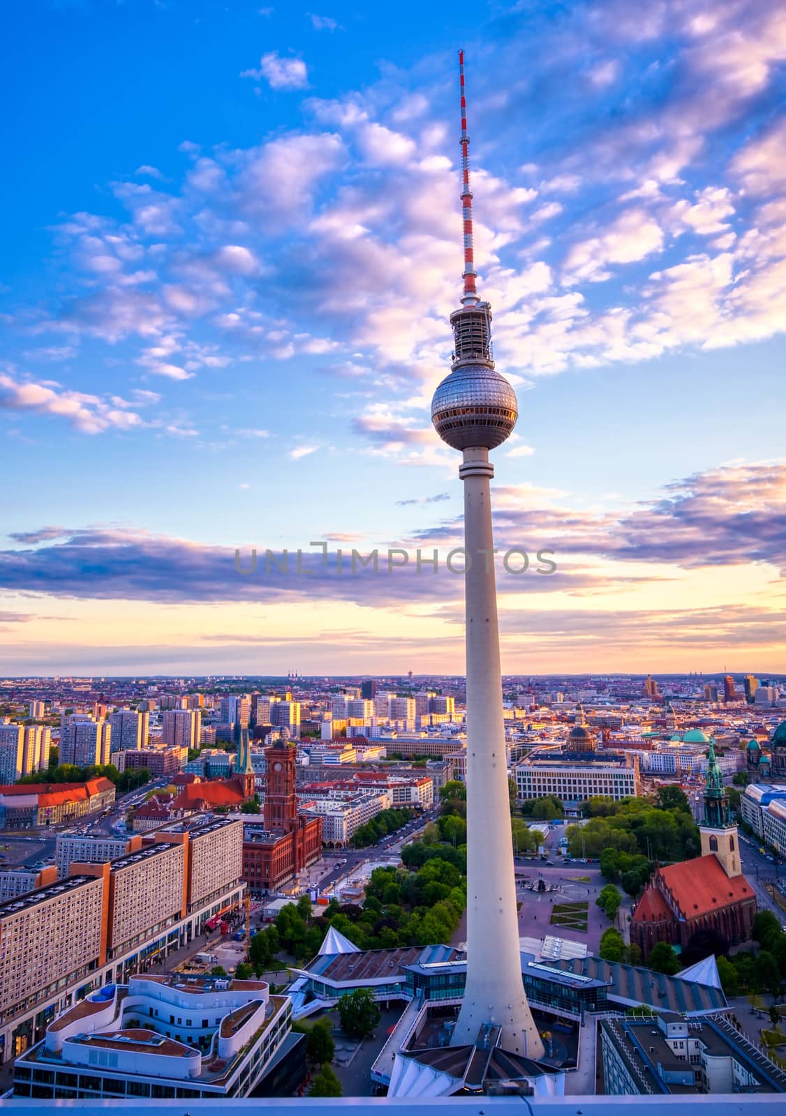 A view of the television tower (Fernsehturm) over the city of Berlin, Germany at sunset.