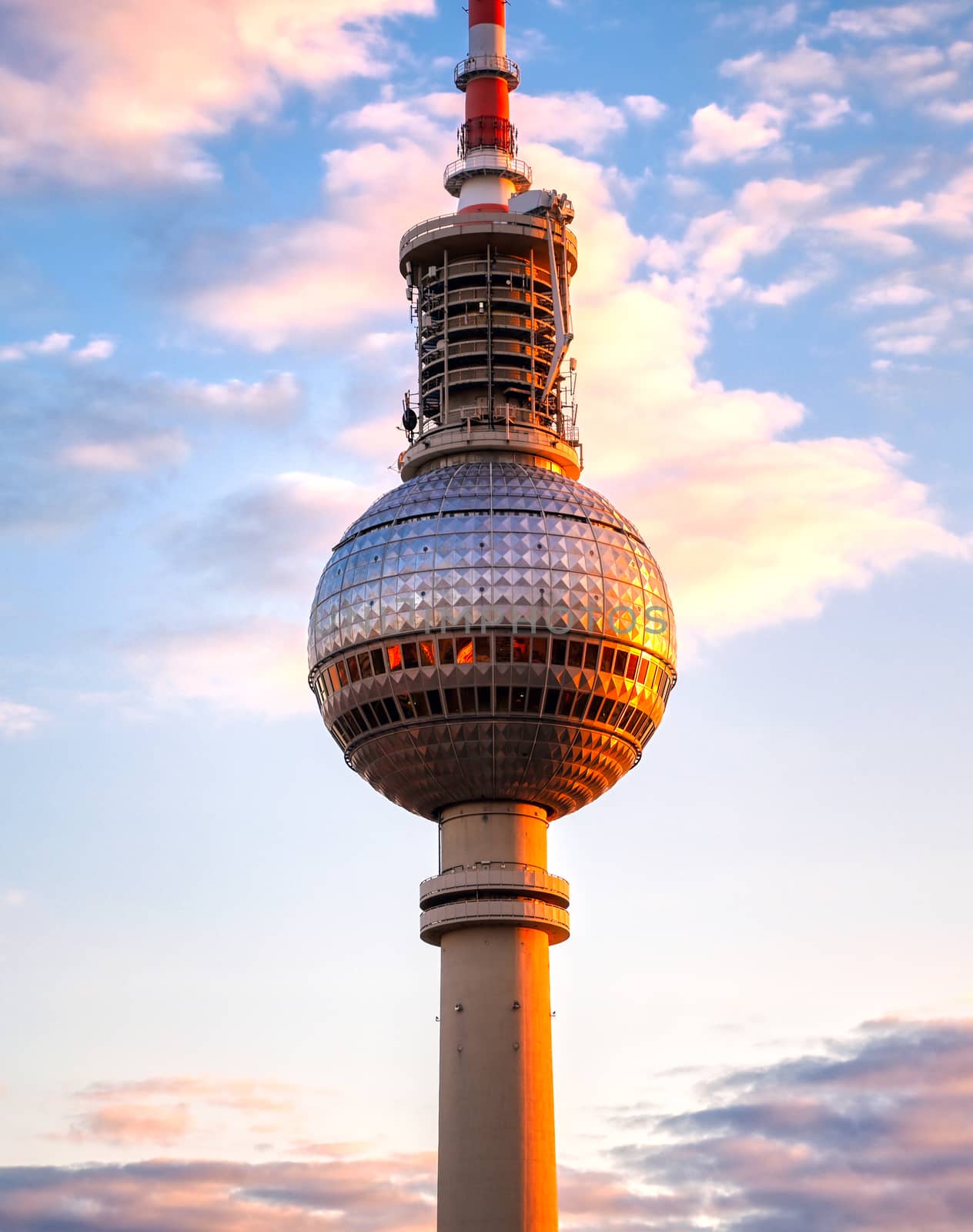 A view of the television tower (Fernsehturm) over the city of Berlin, Germany at sunset.