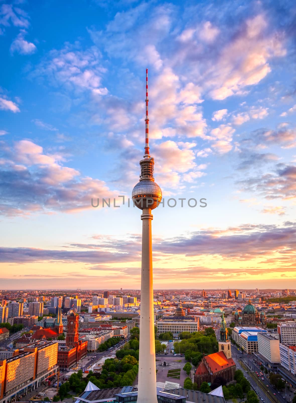 A view of the television tower (Fernsehturm) over the city of Berlin, Germany at sunset.