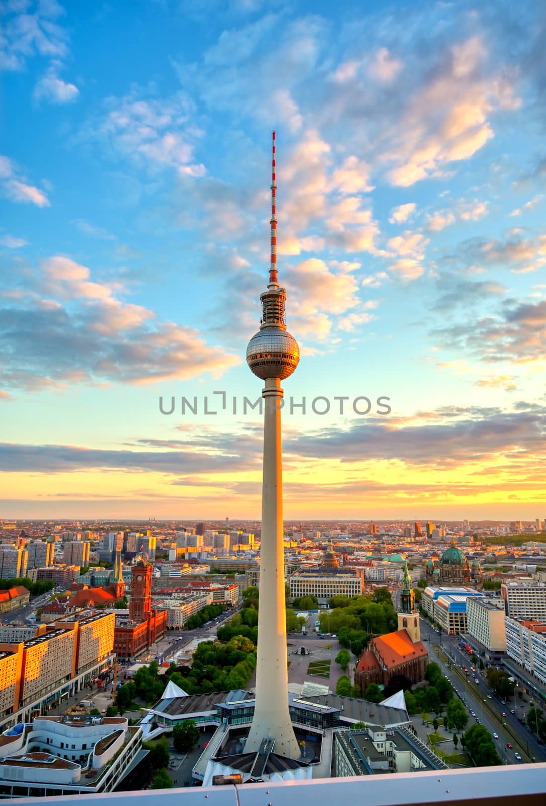 A view of the television tower (Fernsehturm) over the city of Berlin, Germany at sunset.