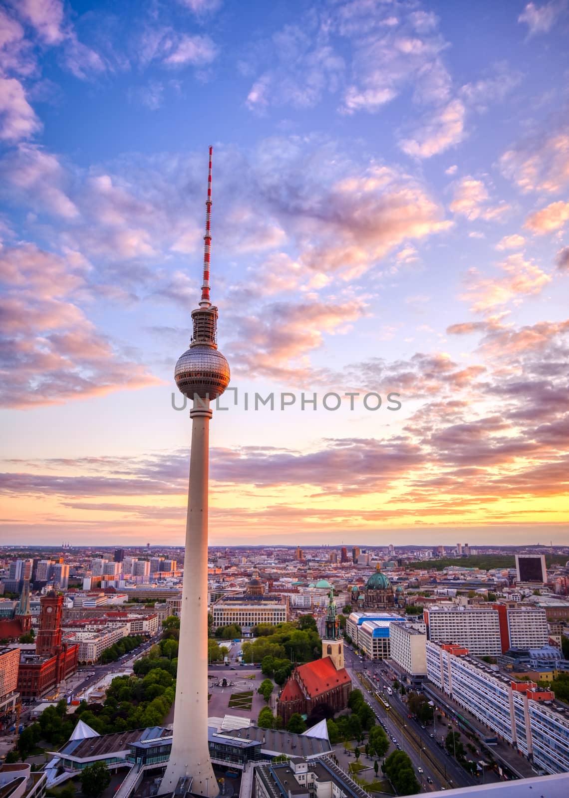 A view of the television tower (Fernsehturm) over the city of Berlin, Germany at sunset.