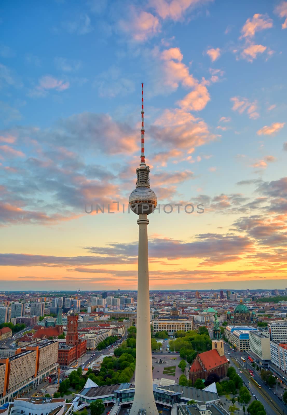 A view of the television tower (Fernsehturm) over the city of Berlin, Germany at sunset.