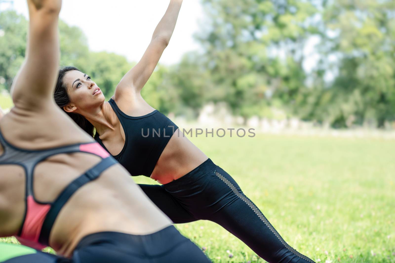 Women practicing yoga by wdnet_studio