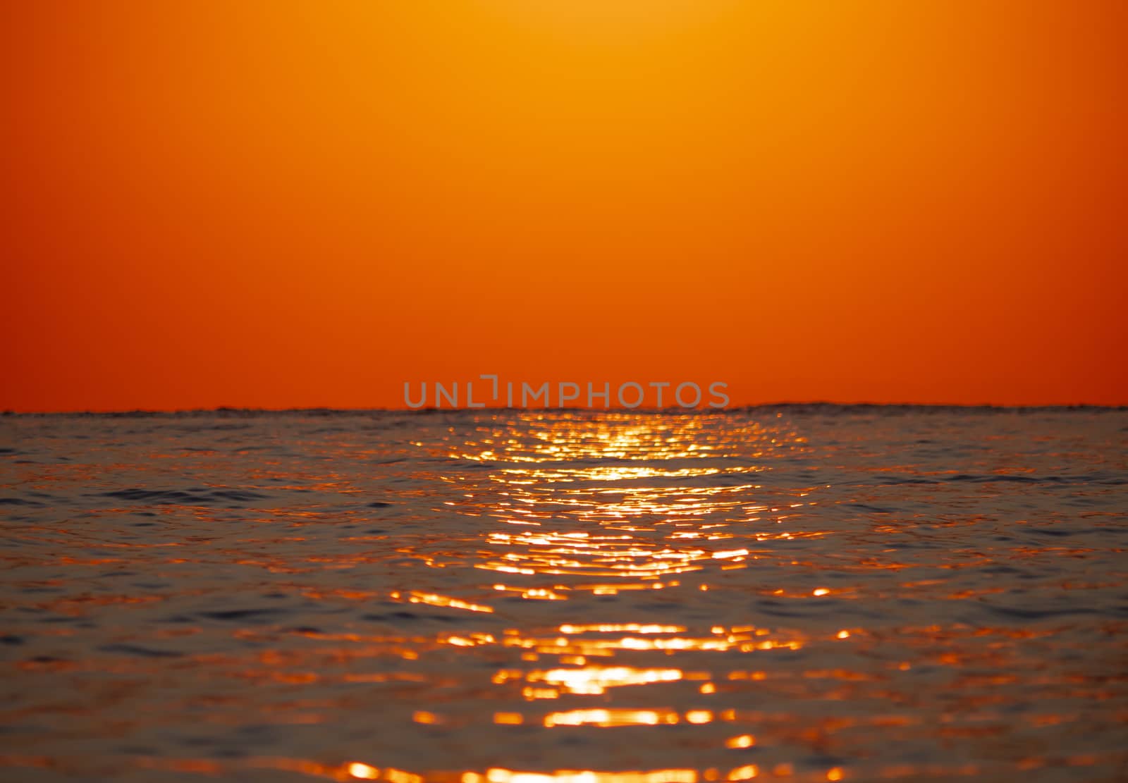 Early morning, dramatic gold sunrise over sea