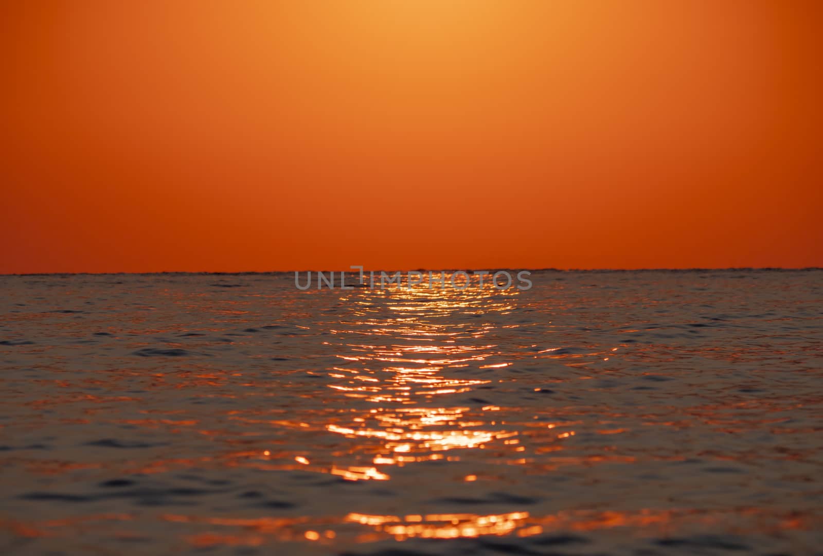 Early morning, dramatic gold sunrise over sea