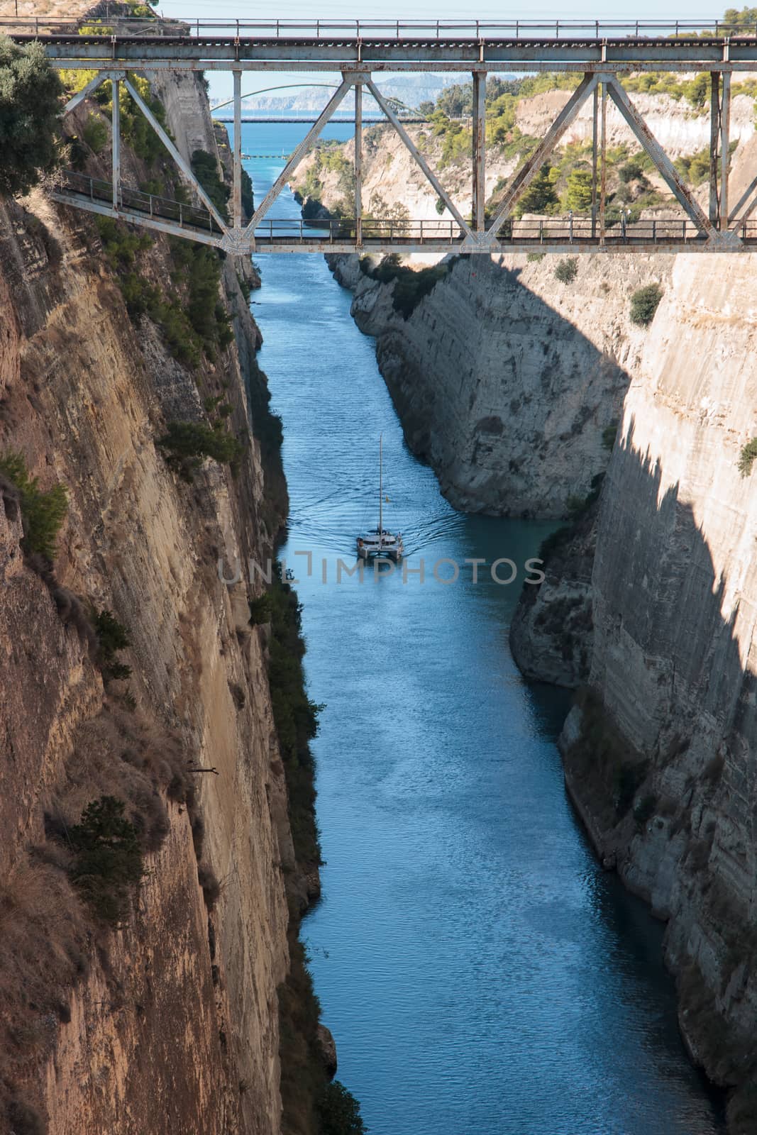 The Corinth Canal, Greece. The Corinth Canal is a canal that connects the Gulf of Corinth with the Saronic Gulf in the Aegean Sea.