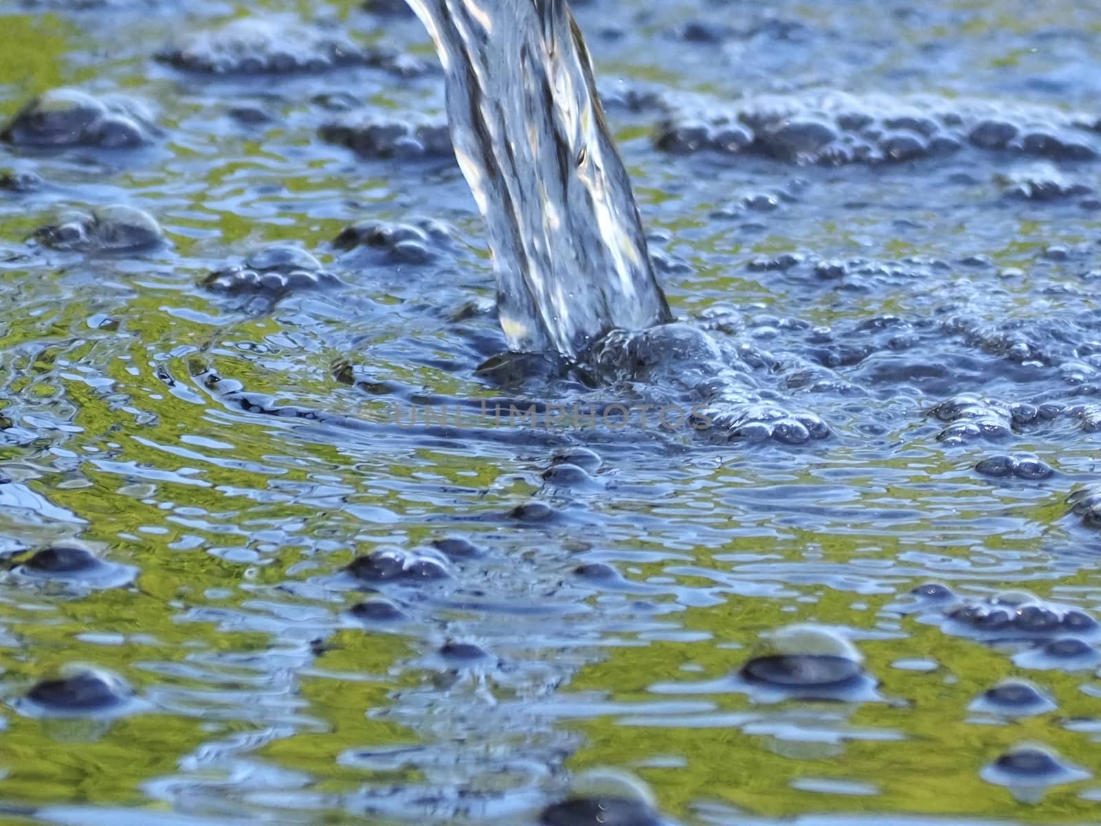 Closeup of water with bubbles in a fountain