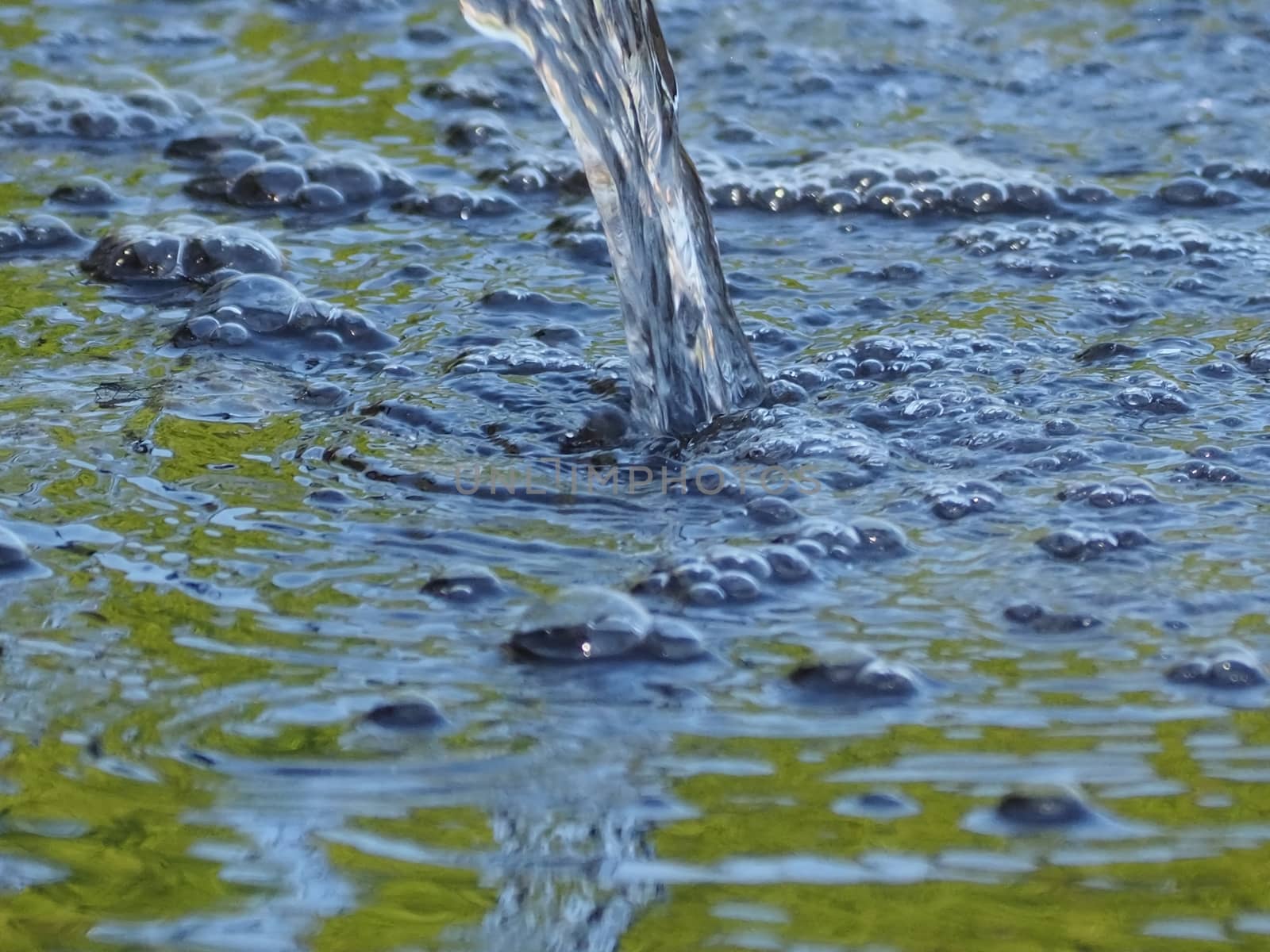 Closeup of water with bubbles in a fountain