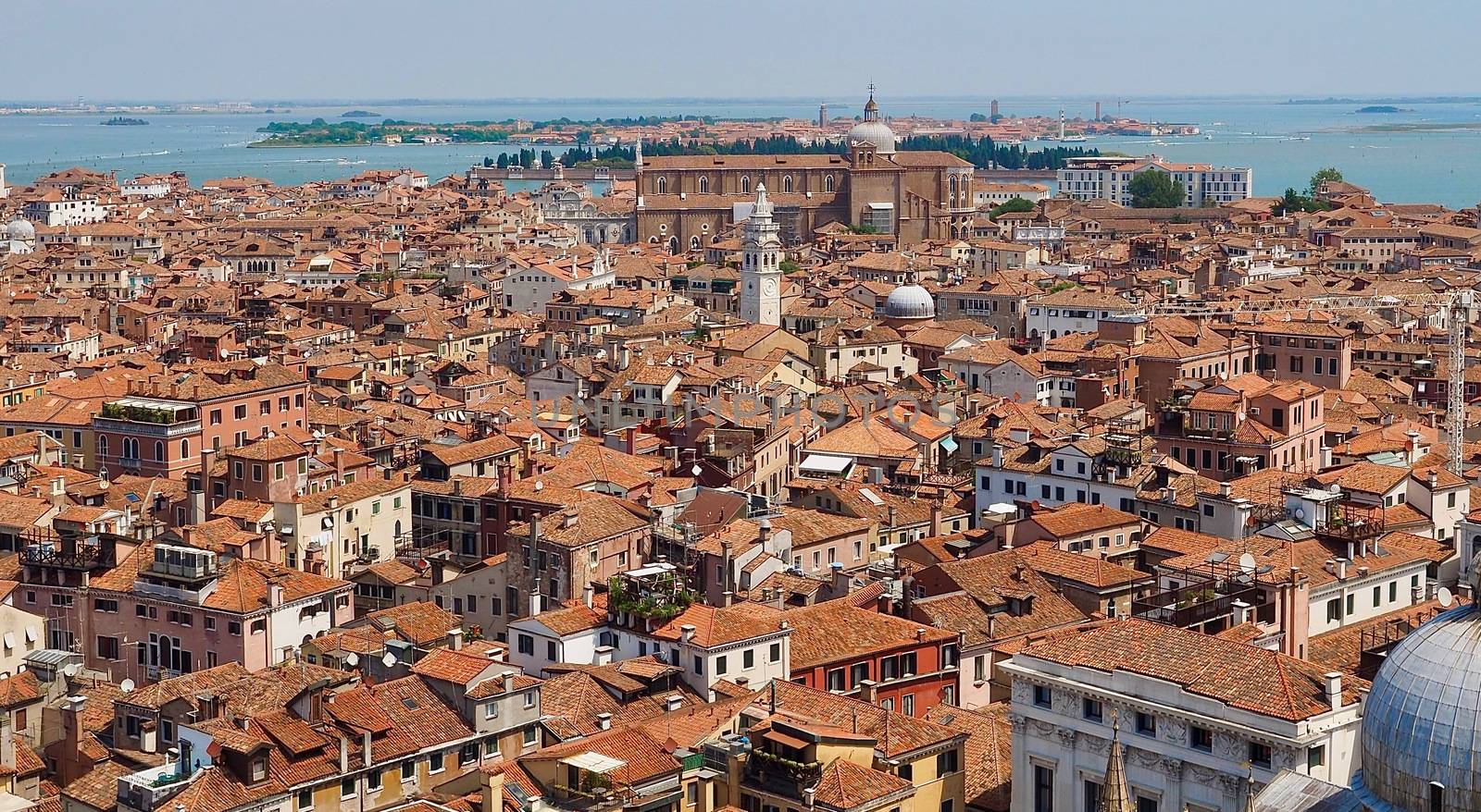 Looking over the red roofs of Venice from the Campanile in direction tower Santo Stefano