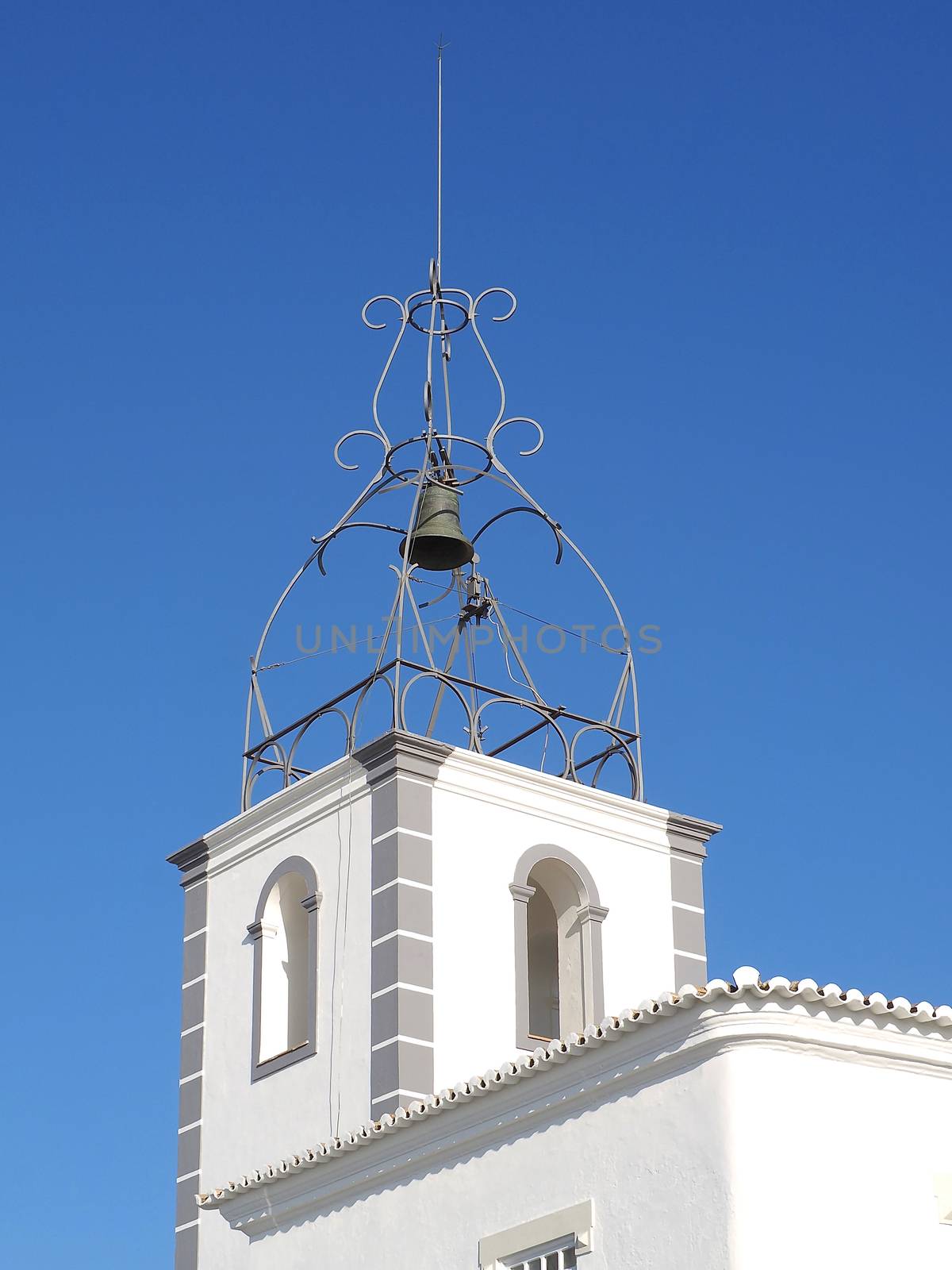 White bell tower church in oldtown of Albufeira by Stimmungsbilder
