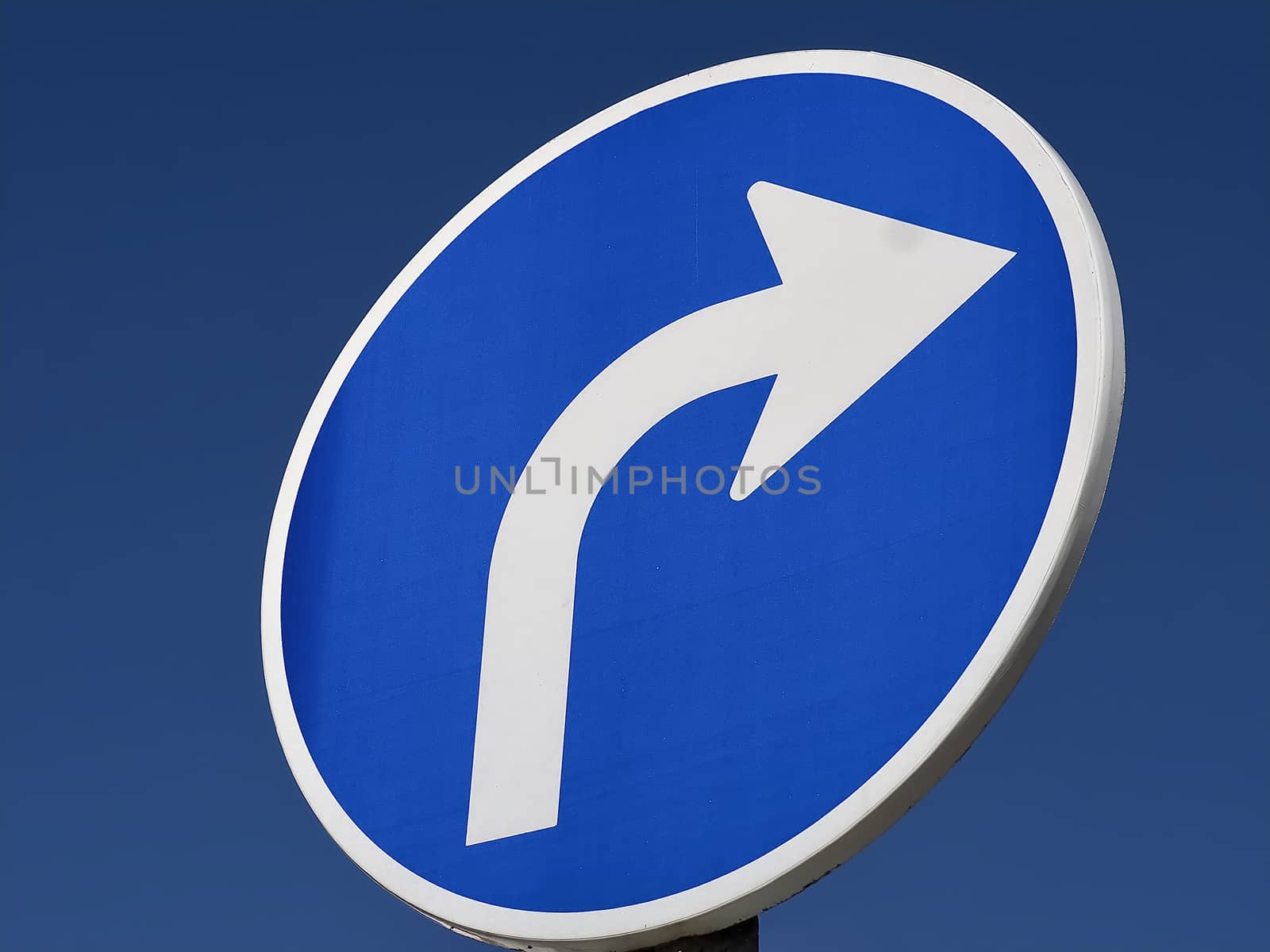 Blue street sign turn right with a white arrow by Stimmungsbilder