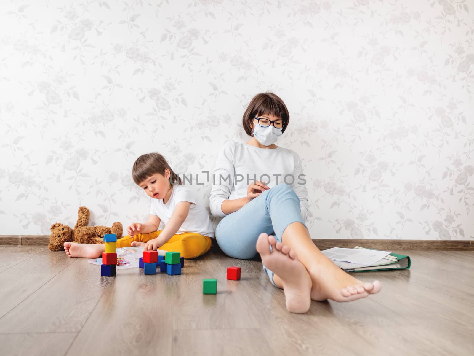 Mom and son at home quarantine because of coronavirus COVID19. M by aksenovko
