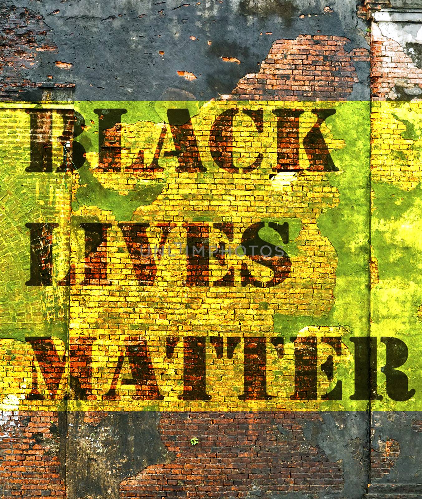 Black Lives Matter slogan protestors anti Black racism african American yellow stencil brick wall background