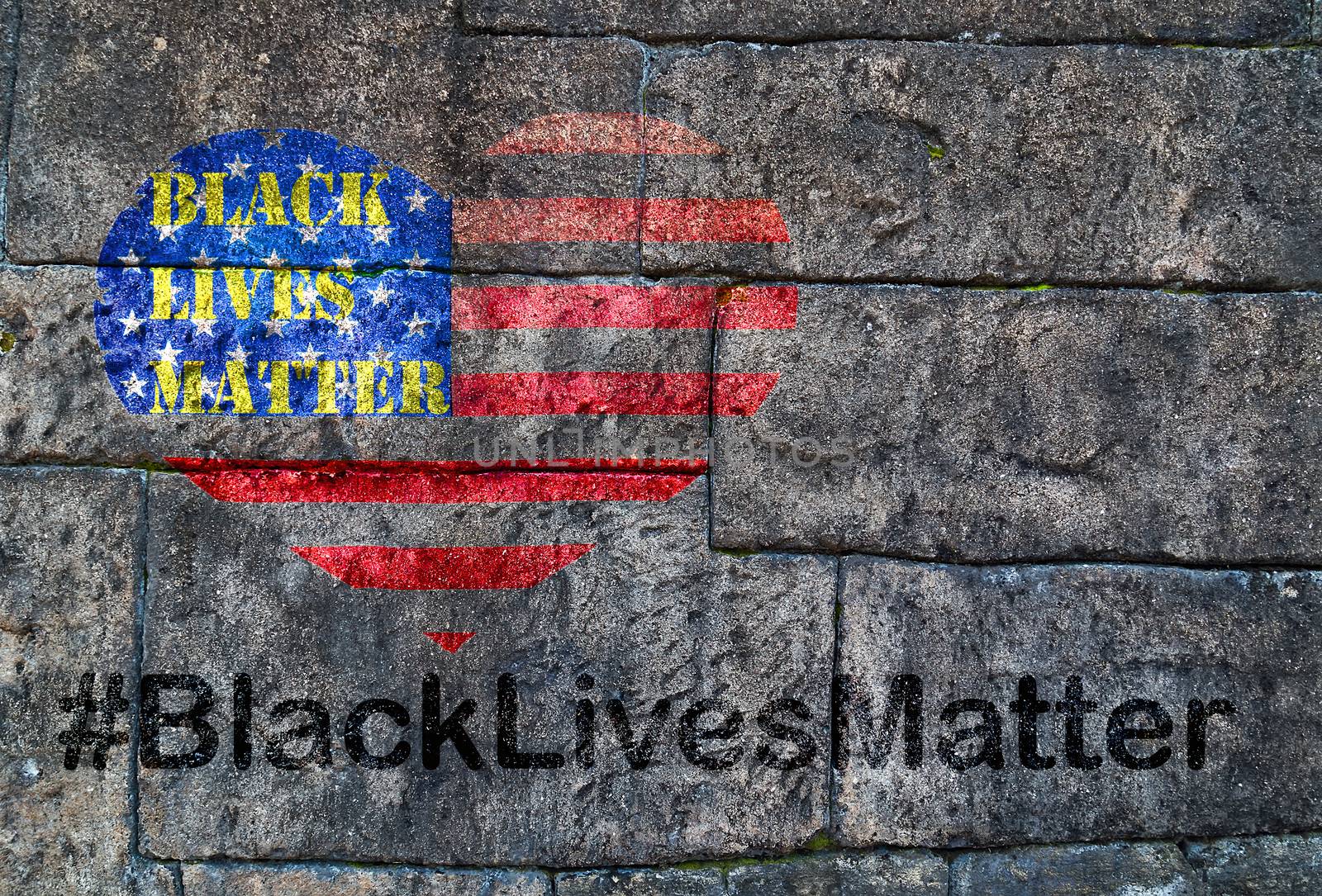 Black Lives Matter hashtag protestors anti Black racism african american people heart on United States flag stencil city street Old brick wall background texture stone black