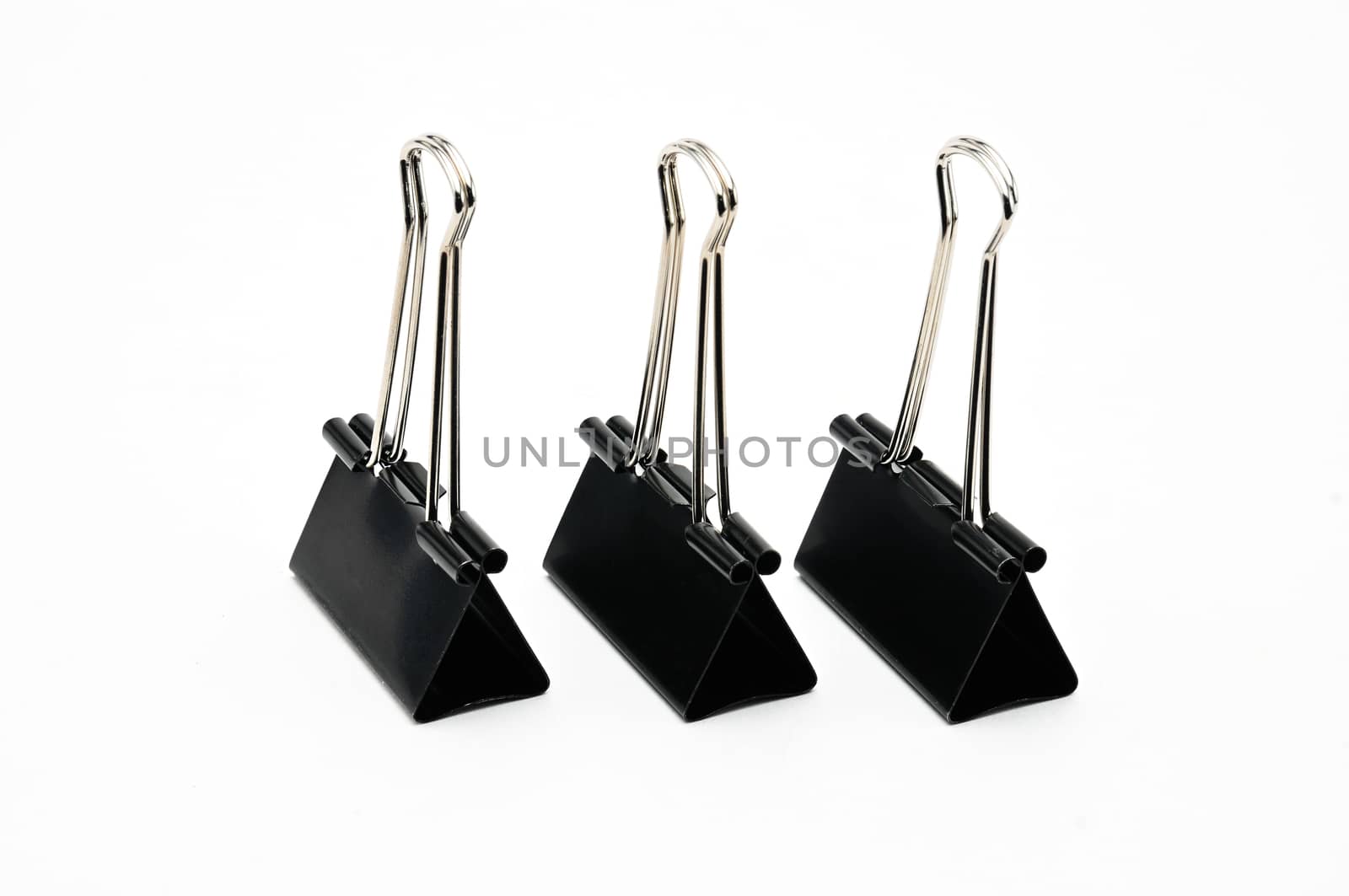 Binder clips paper clamp on an isolated background by moviephoto