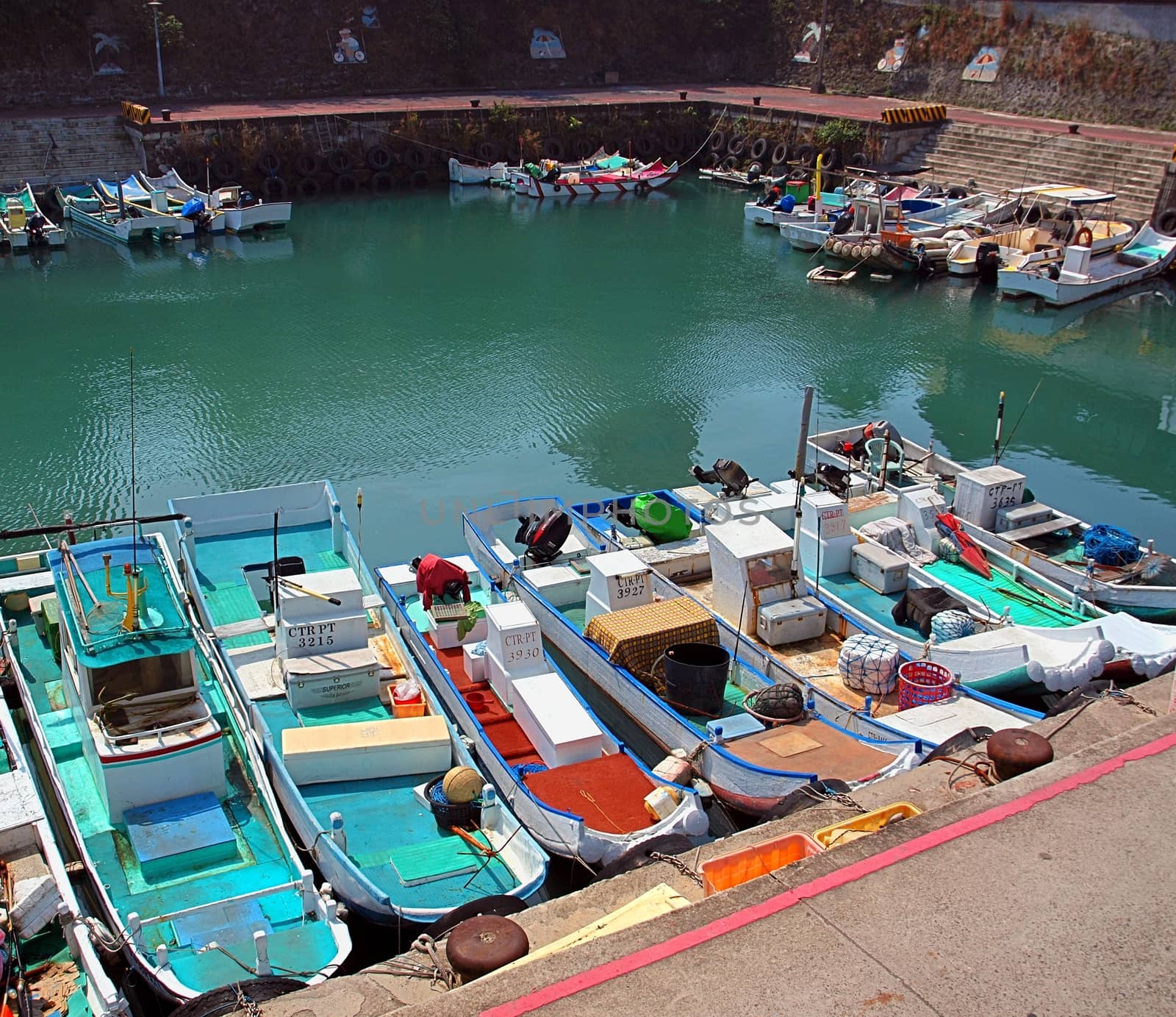 LIUQIU, TAIWAN -- SEPTEMBER 23:  Small fishing boats on the island of Liuqiu seek refuge in port to take shelter from the  approaching typhoon Usagi, on September 23, 2014 in Liuqiu.