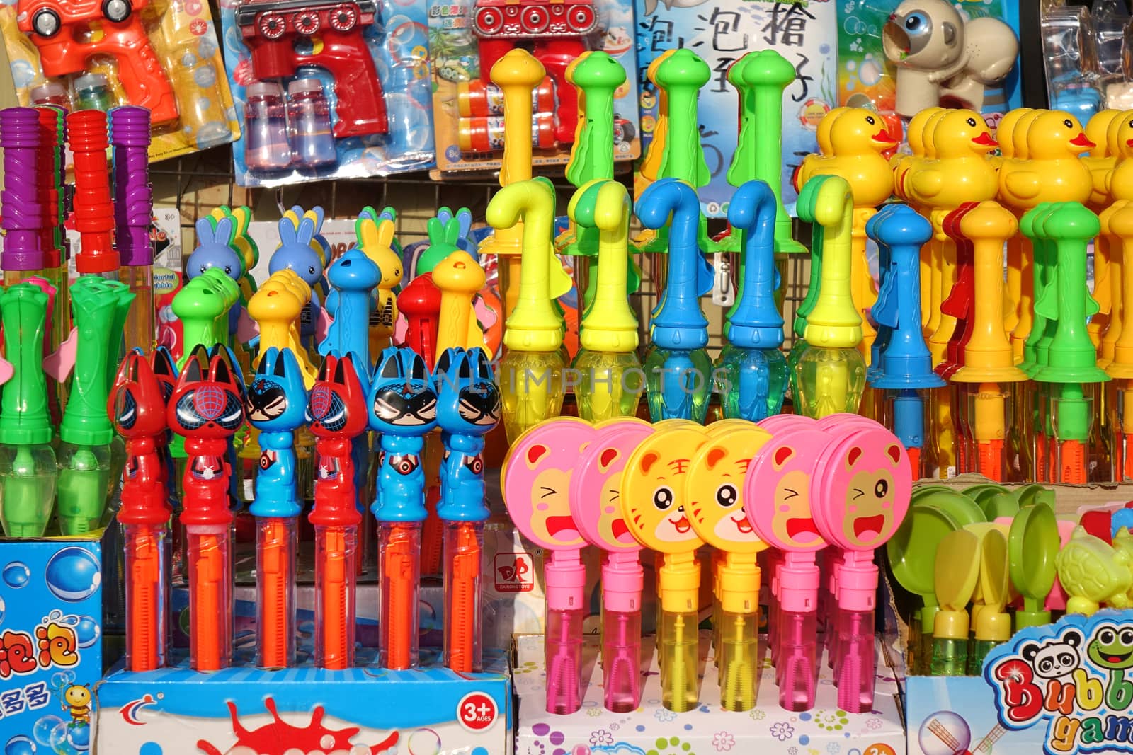 KAOHSIUNG, TAIWAN -- DECEMBER 14, 2019: A street vendor sells colorful toys used to make soap bubbles.
