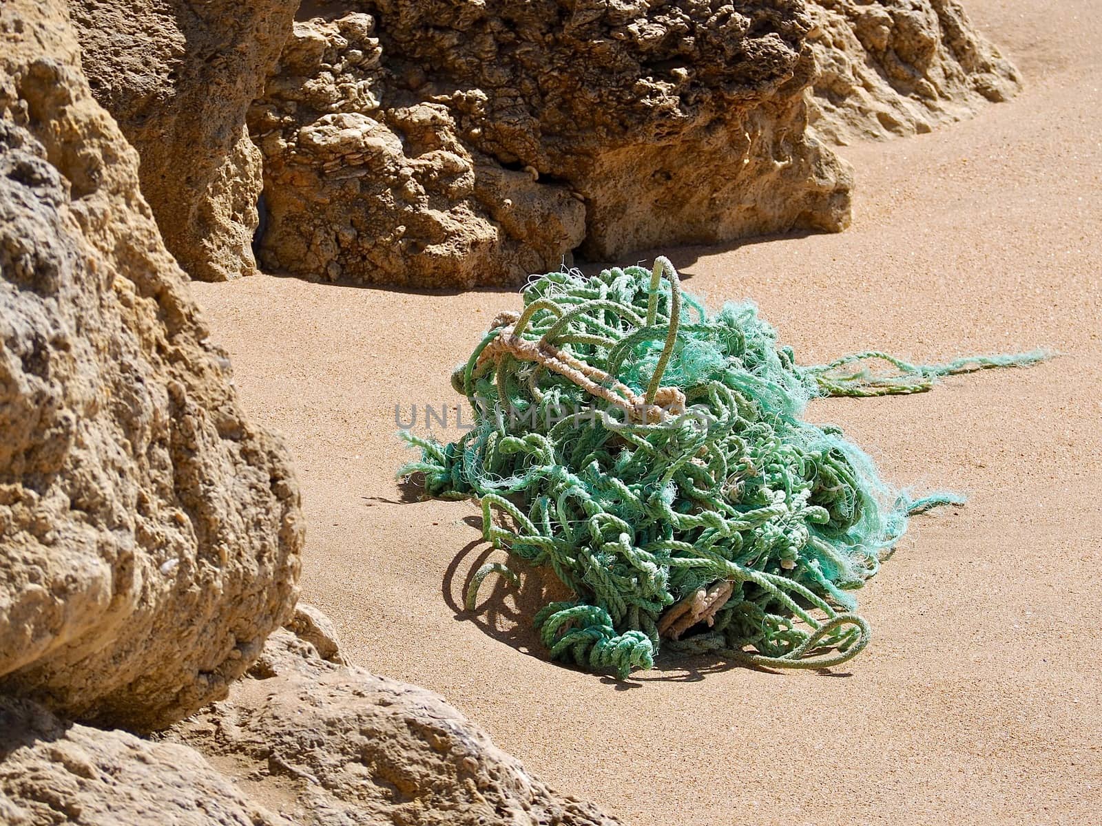 Green fisher ropes on a sandy beach by Stimmungsbilder